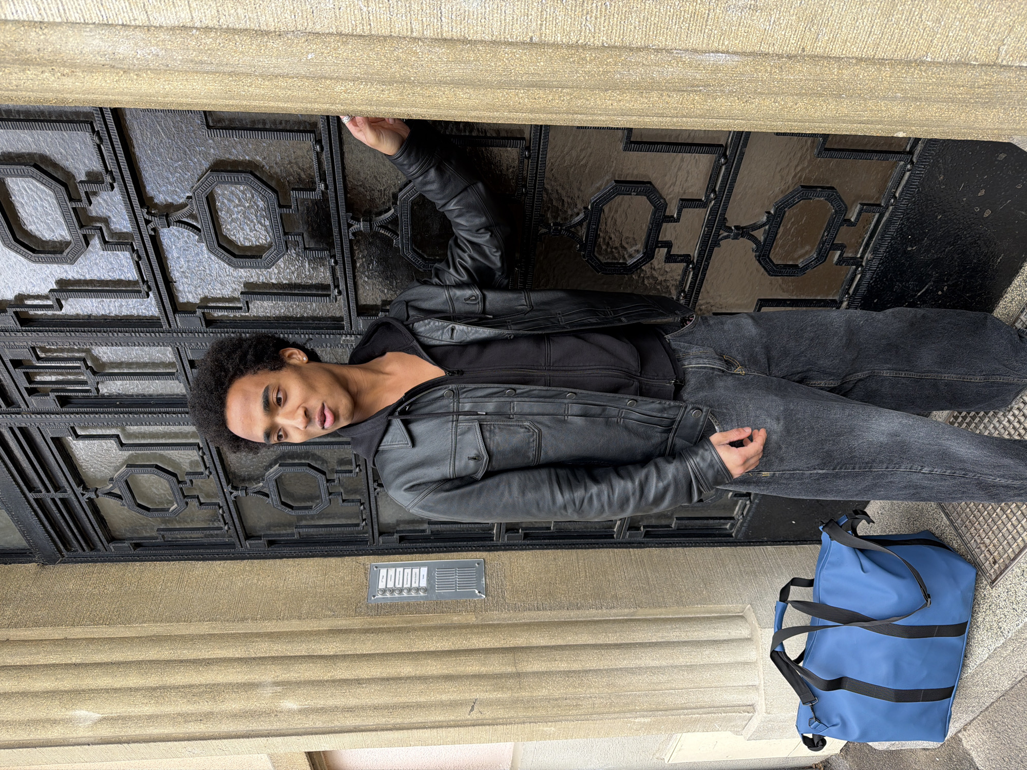 Young man stands outside ornate building in Strasbourg