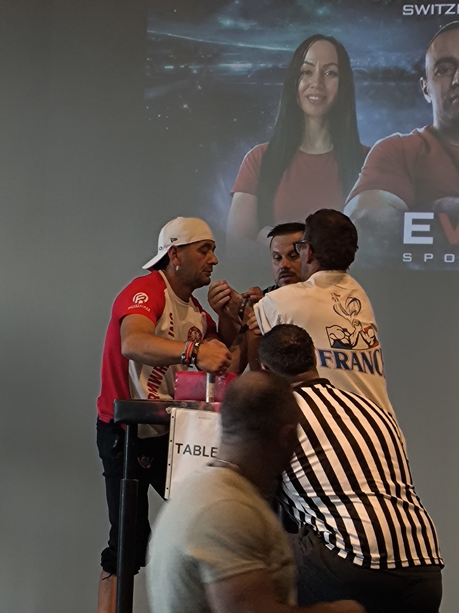 Arm wrestling tournament with matches and medal ceremonies