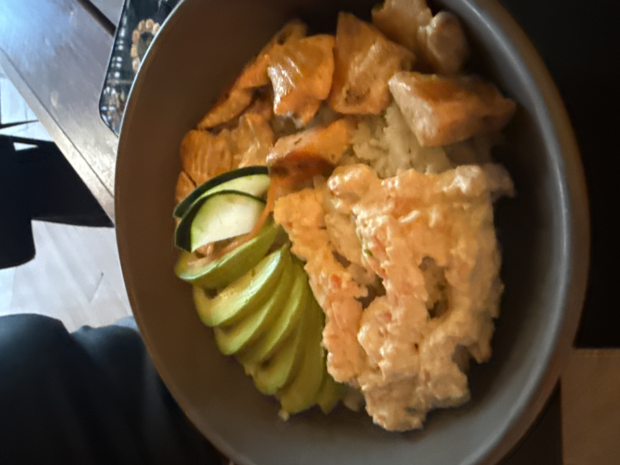 Woman documents dining experience at sushi restaurant in Mexico