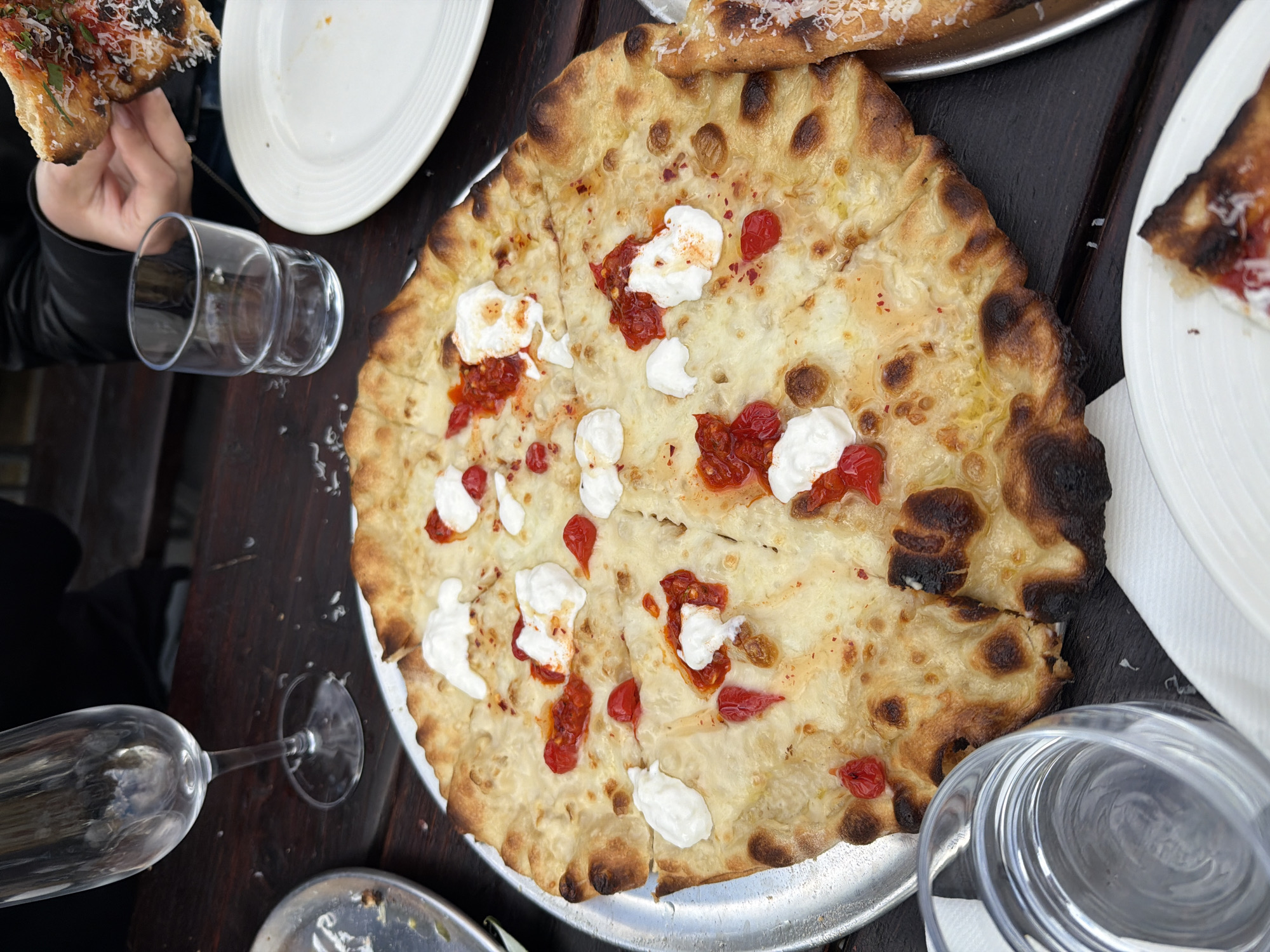 Diners share pizza at London's Weezie's restaurant during afternoon meal