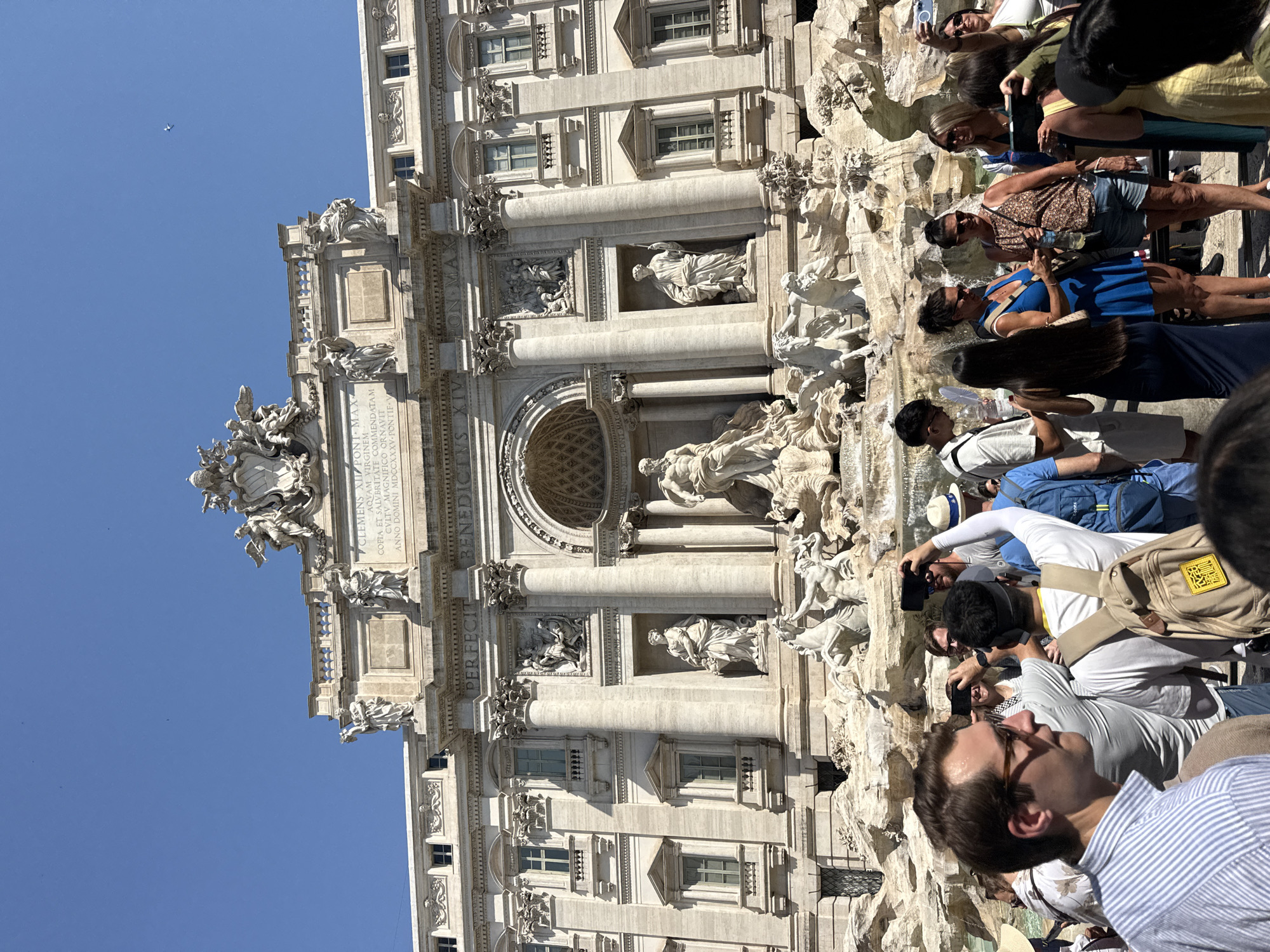 Busy morning crowd at Rome's Trevi Fountain