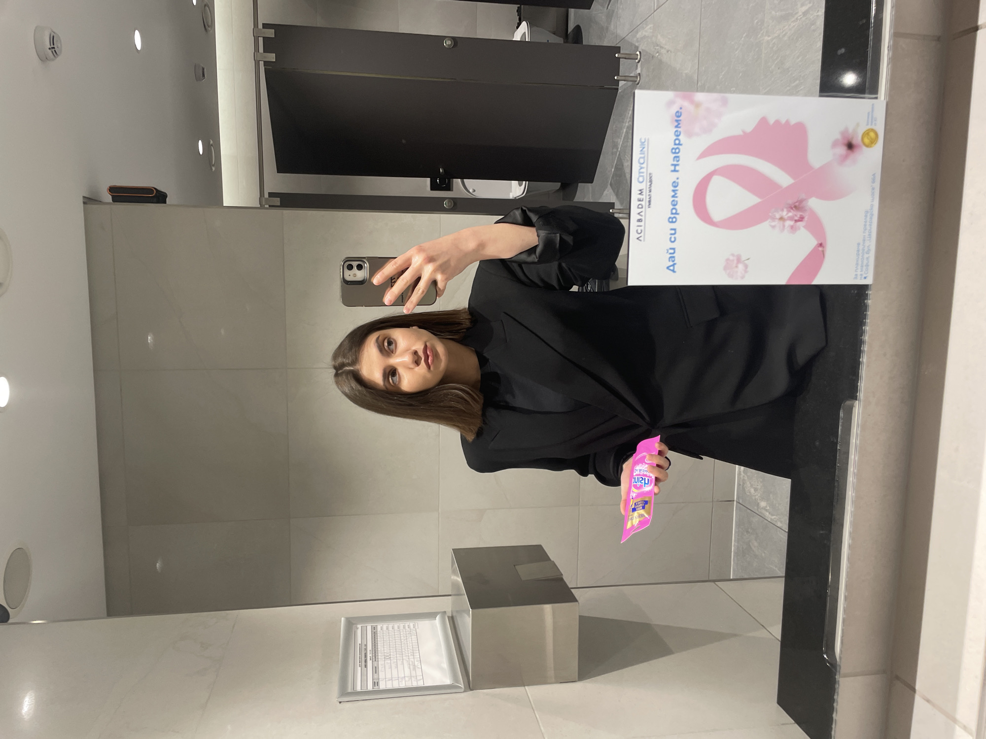 Woman Takes Selfies at Eyewear Store and Restroom in Sofia