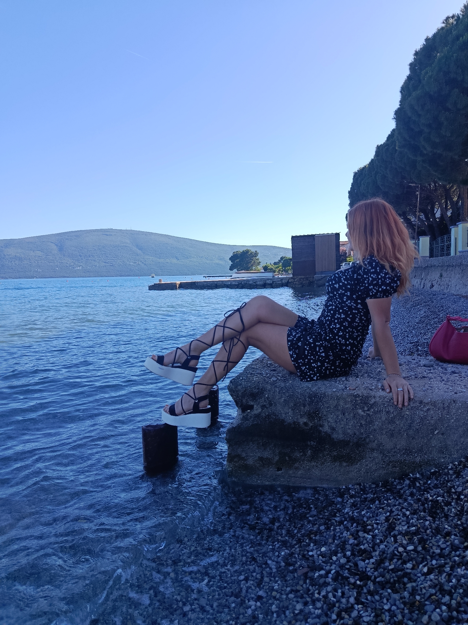Afternoon beach life documented in Bijela, Montenegro coastal scene