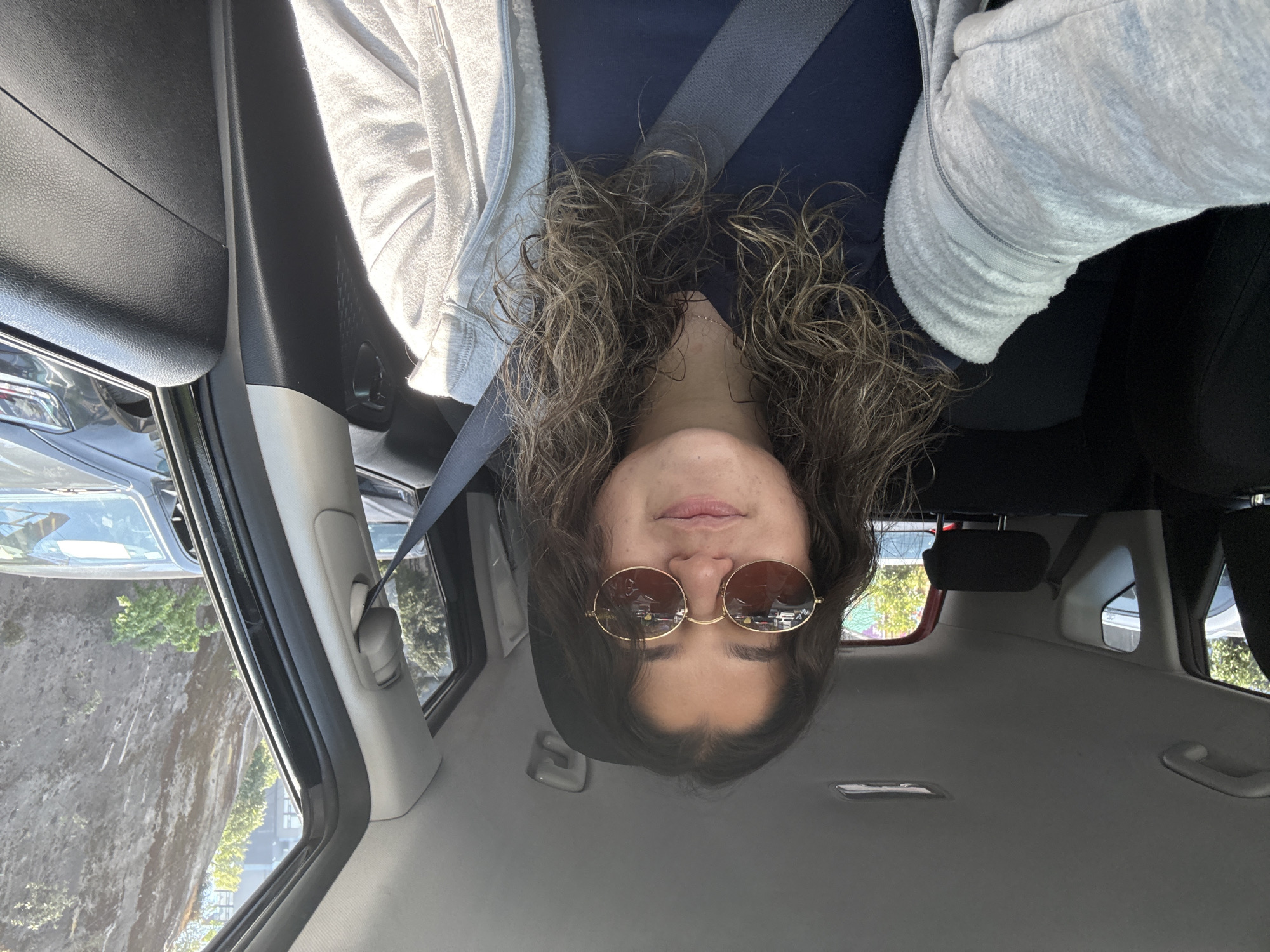 Person photographed in car from low angle in Mexico City