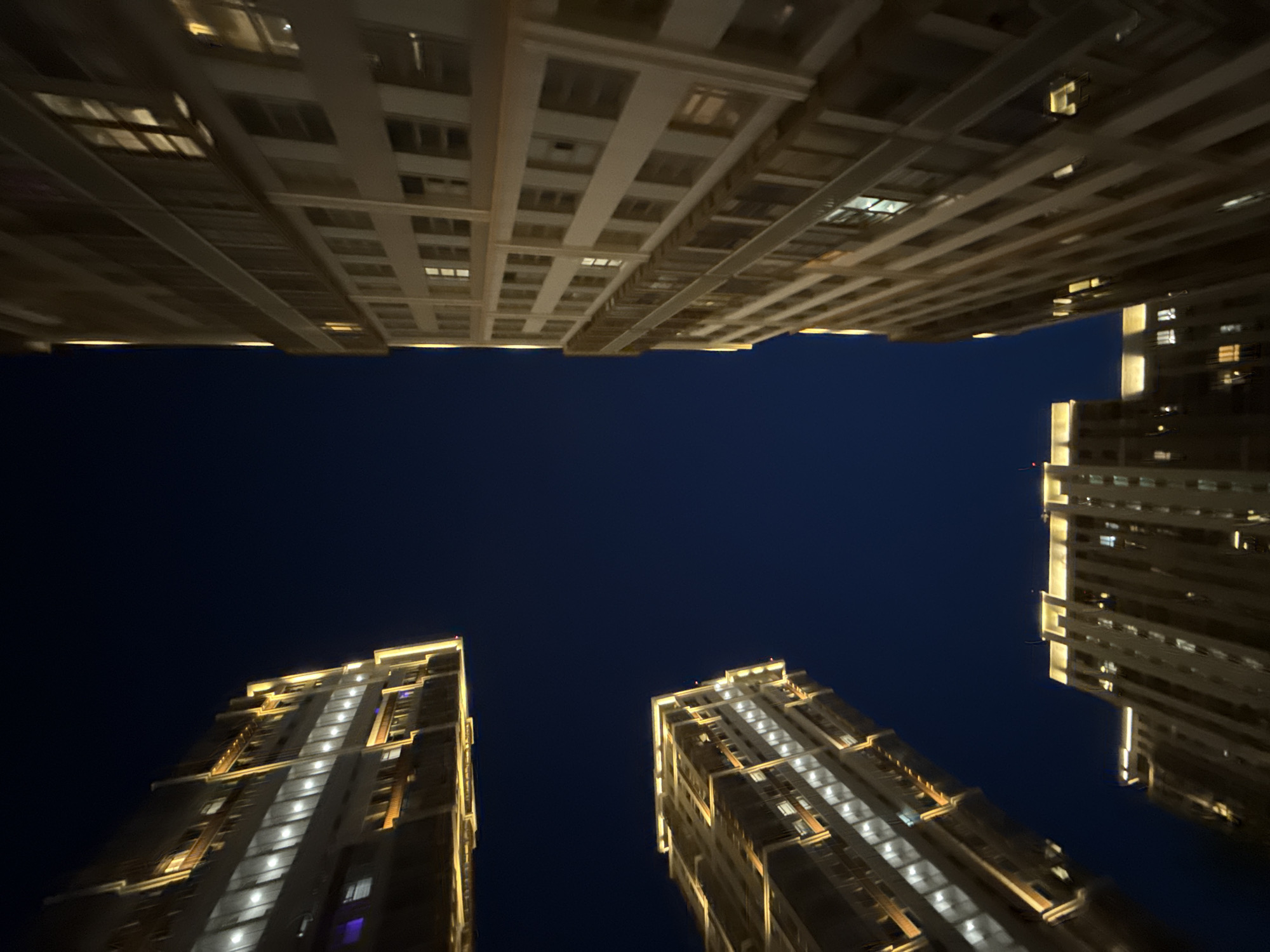 Moscow night: modern apartment towers and a Leone boxing glove
