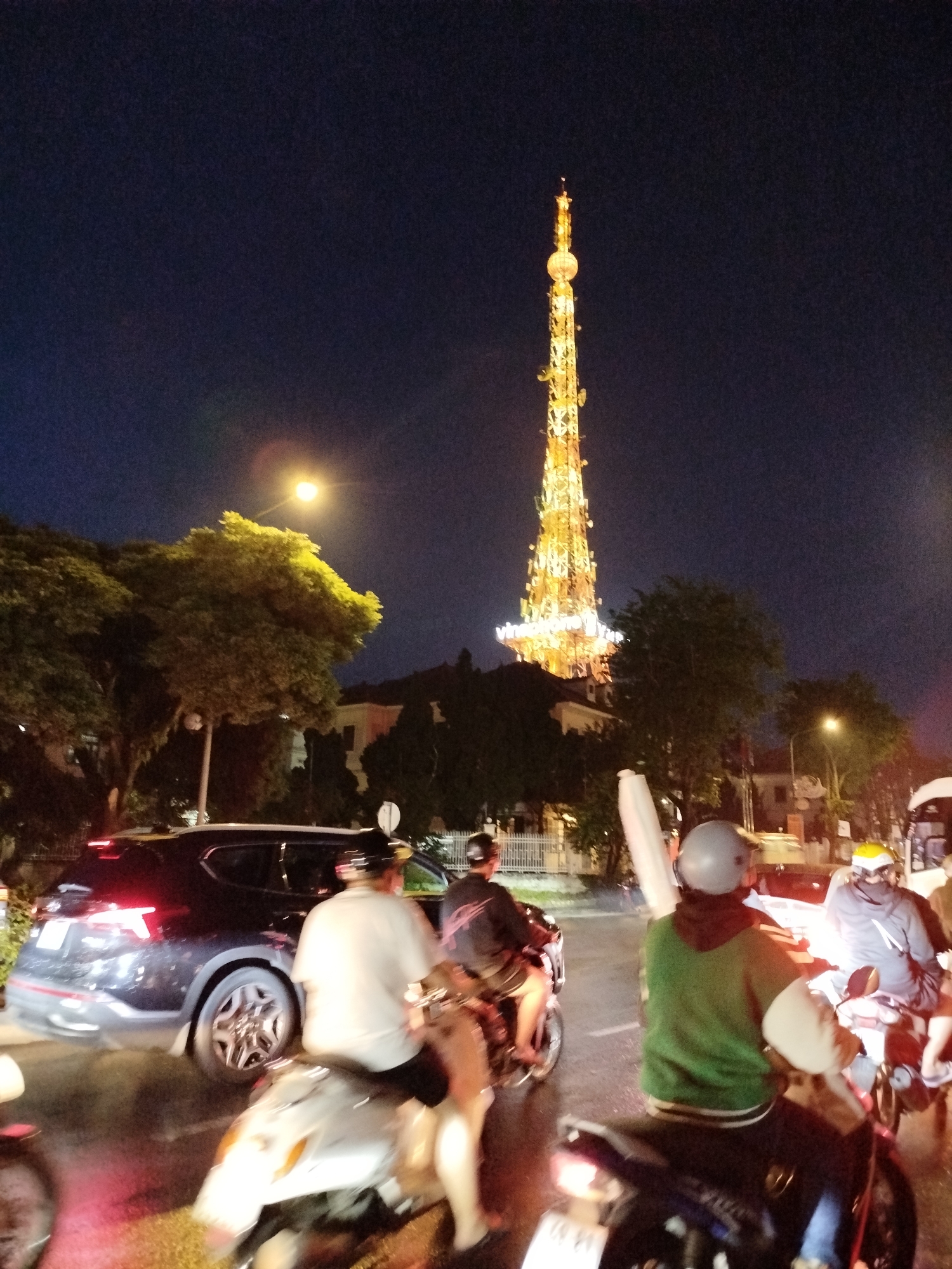 Illuminated Vinaphone tower observed at night in Da Lat