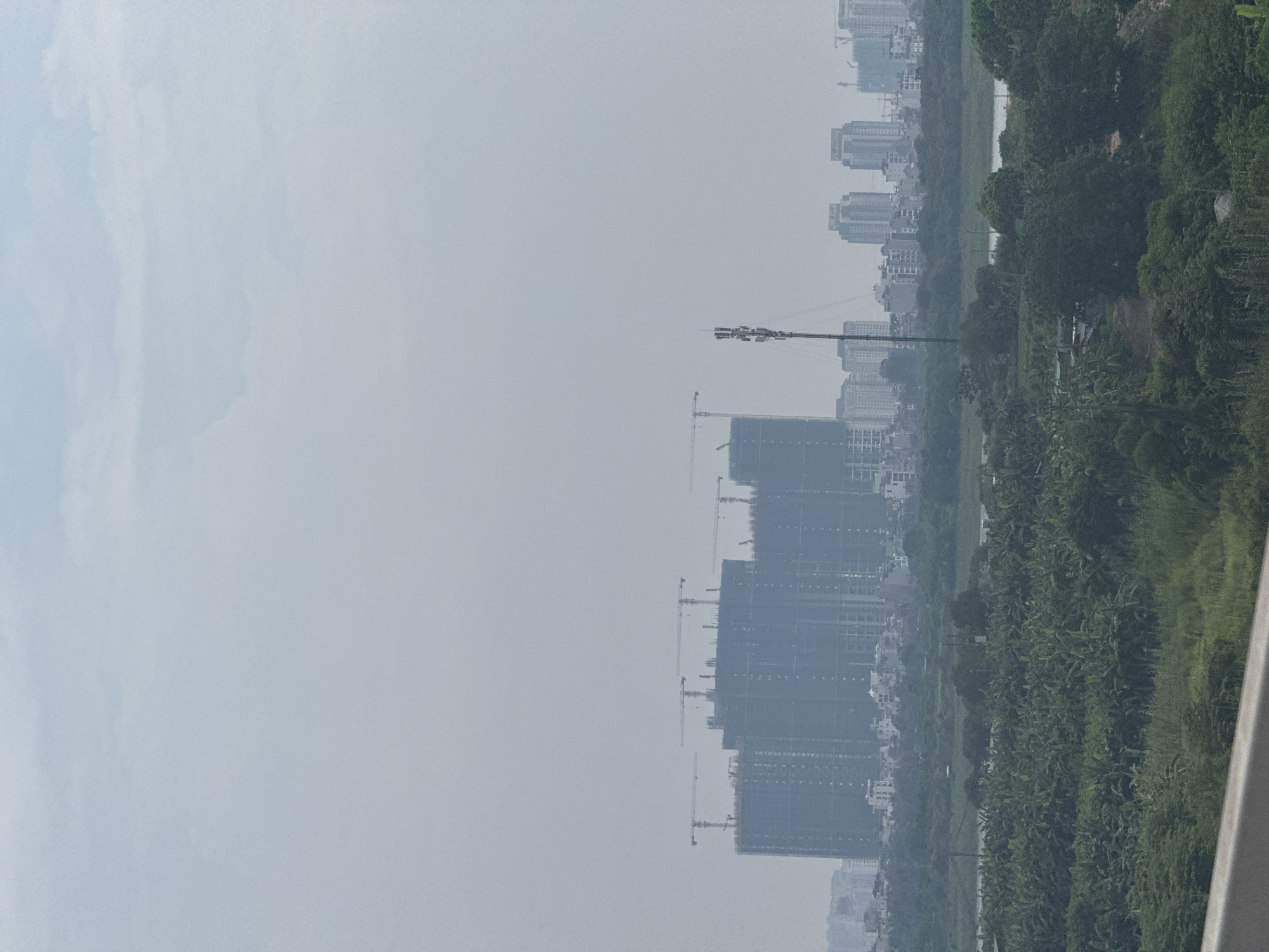 Nhat Tan Bridge and Hanoi's northern skyline on a hazy morning