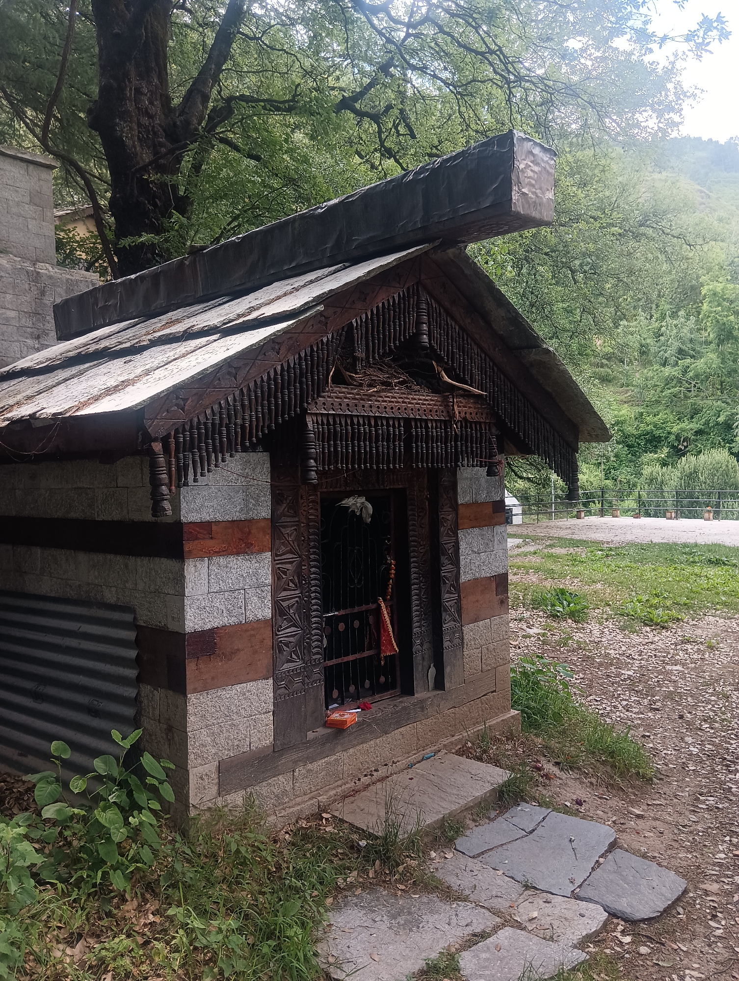 Temple carvings, shrines, and village views in Majhach, India