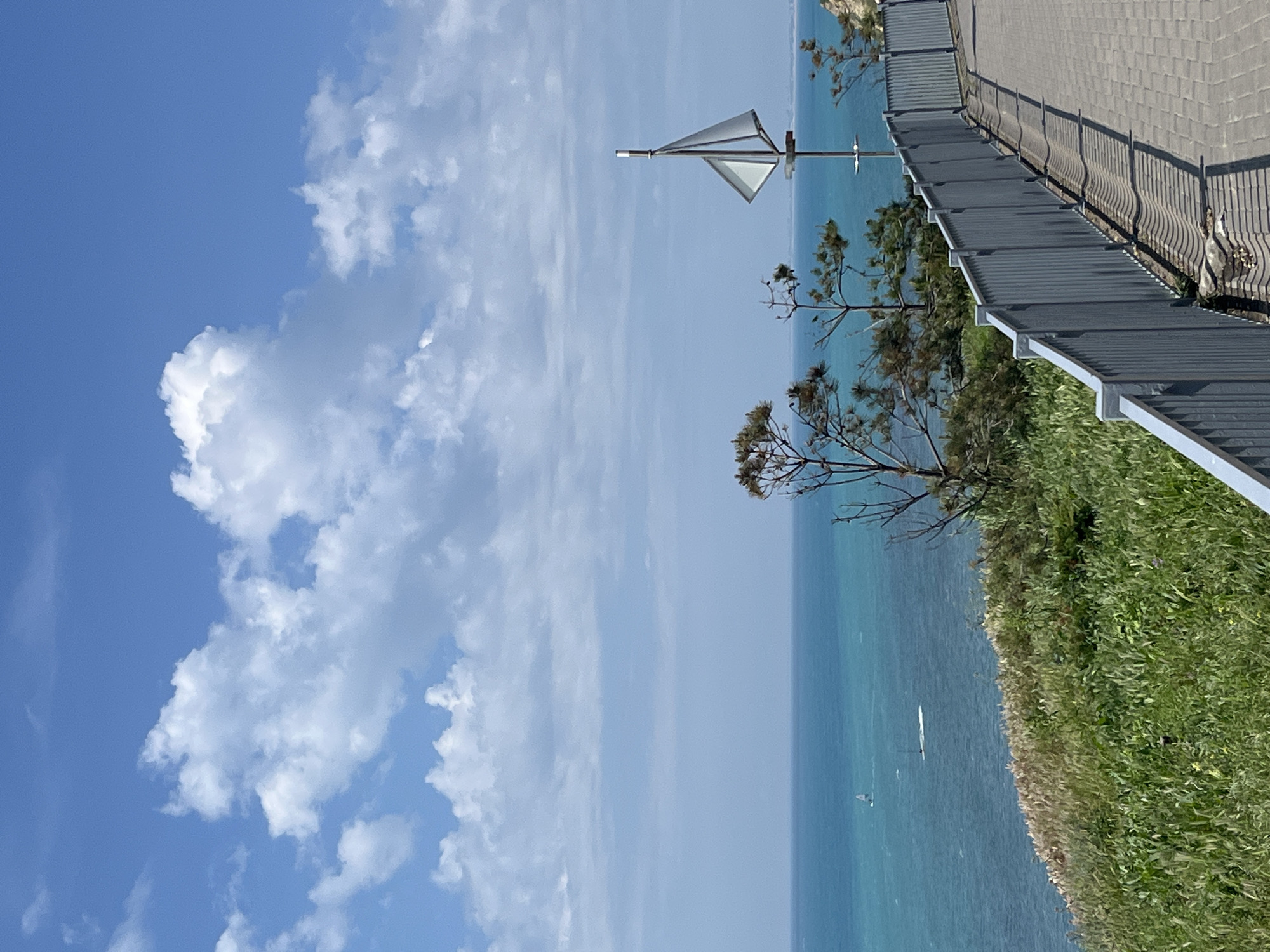 Elderly hiker enjoys sunny morning on Anapa seaside promenade