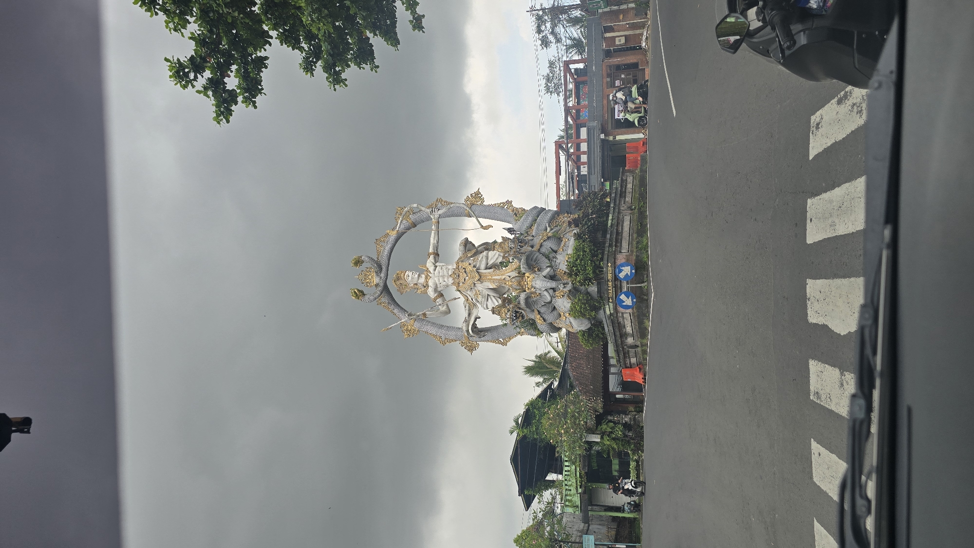 Hindu deity statue observed at Ubud roundabout intersection