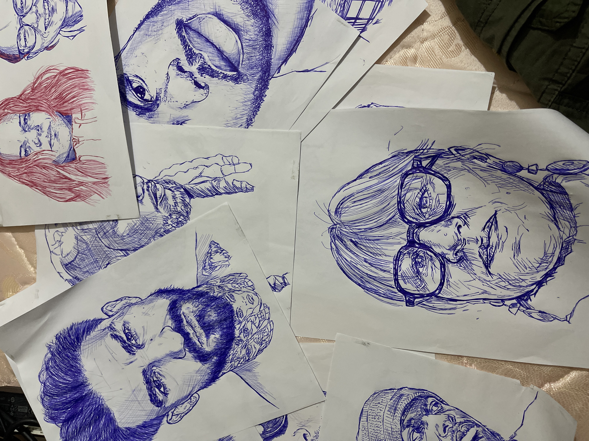 Ballpoint pen portrait sketches laid out in Jos, Nigeria