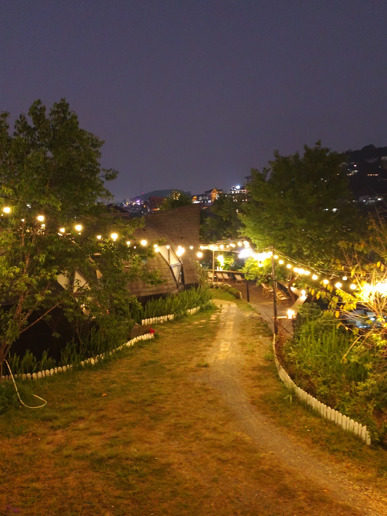 Evening scenes captured around illuminated Da Lat establishments