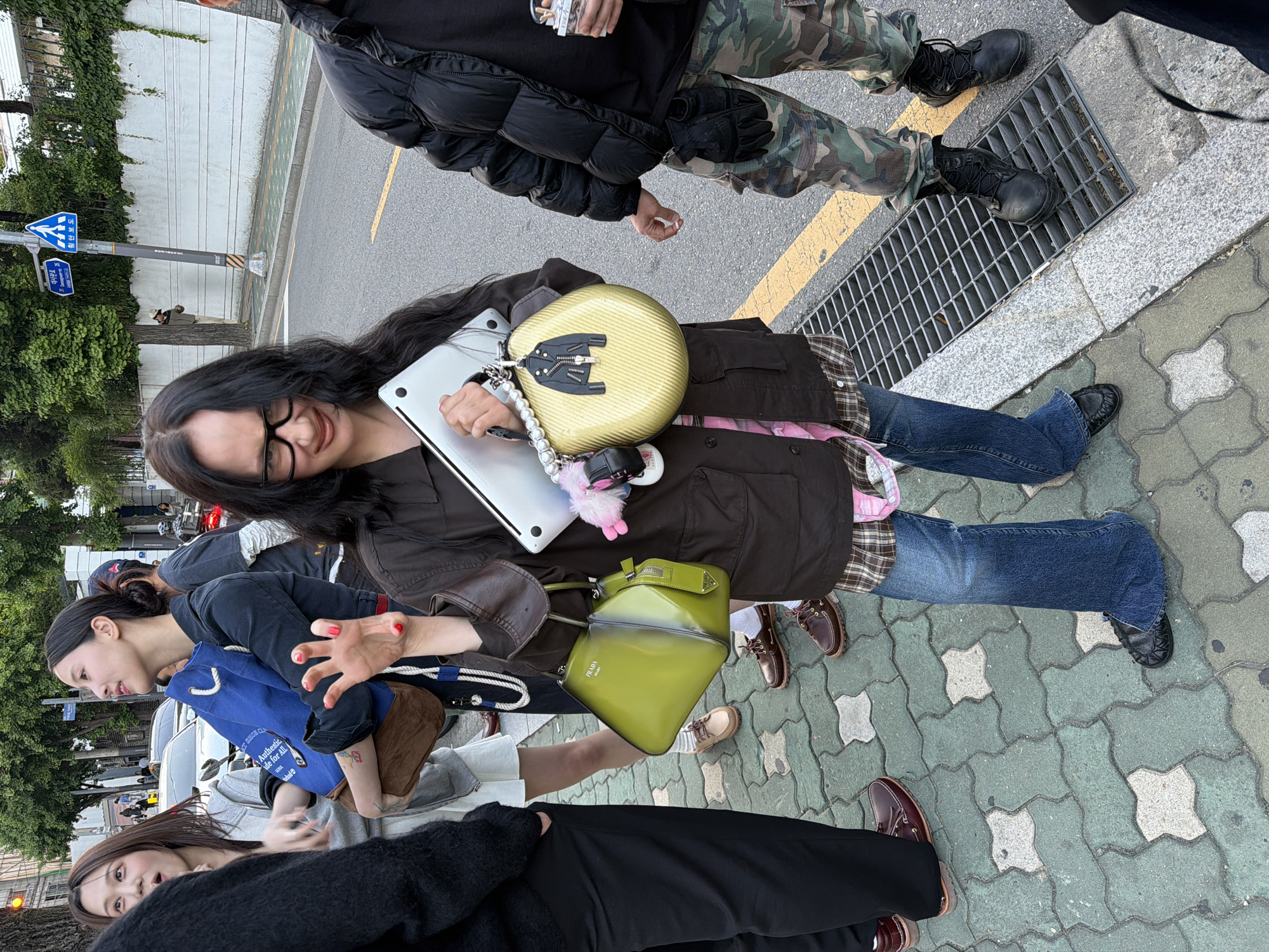 Seoul street scenes: woman with laptop, shoes on display