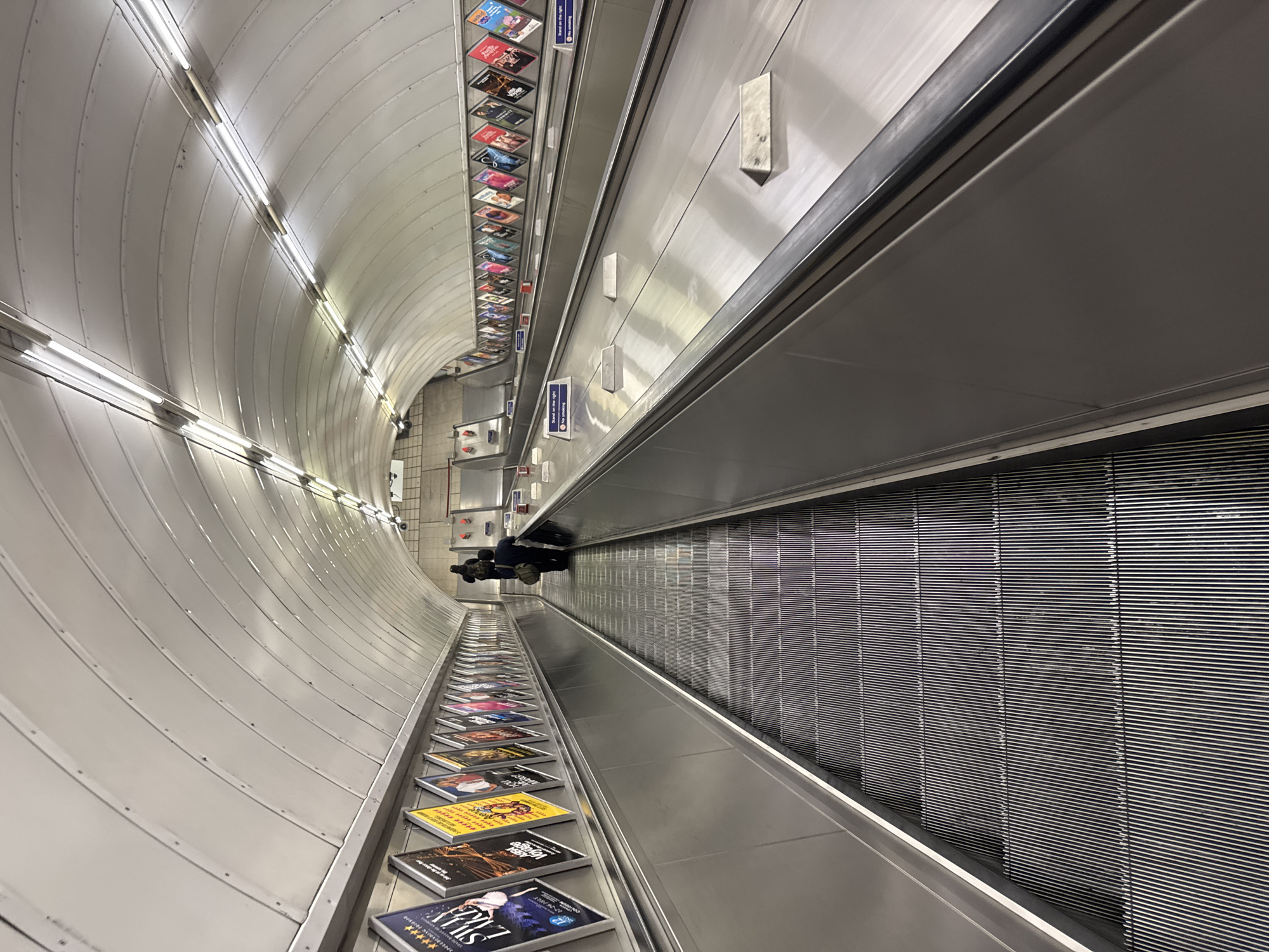 Moving through a London Underground station with luggage