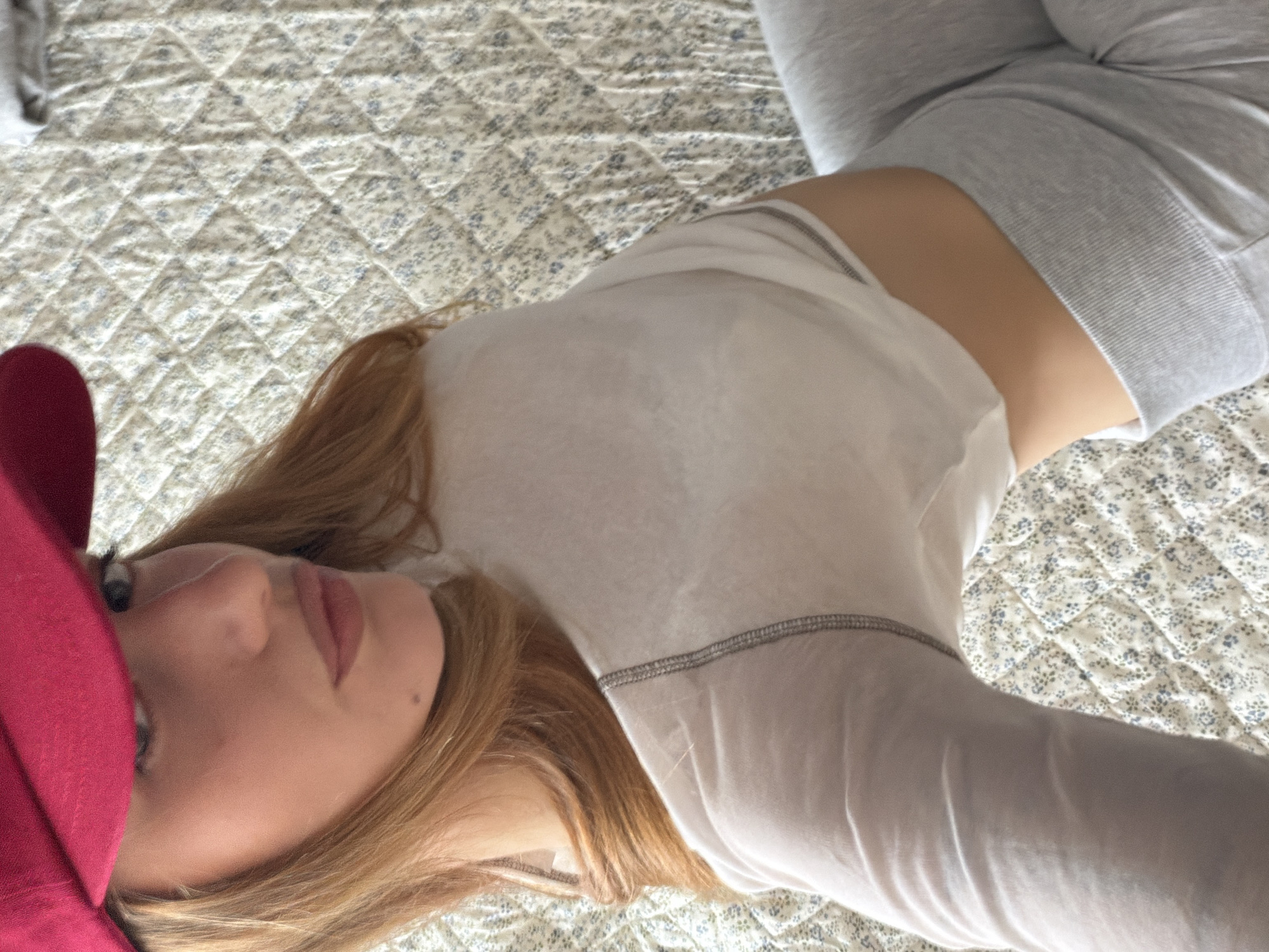 Woman takes mirror selfie in Sofia bedroom