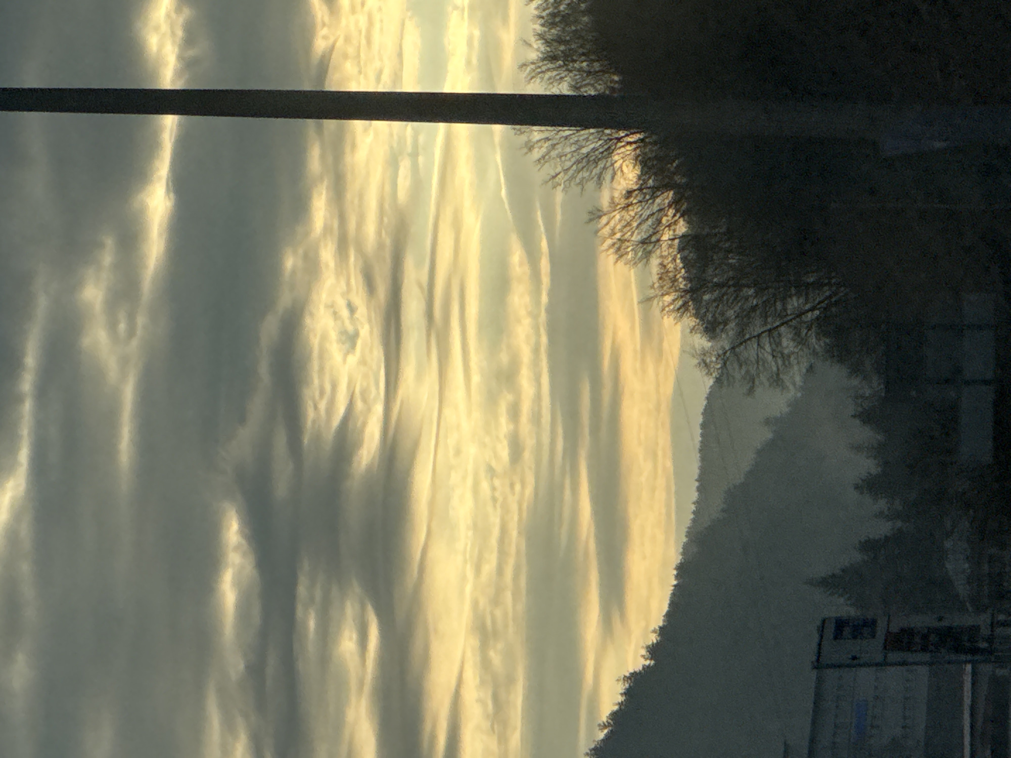 Golden striated clouds photographed during dawn in Smolyan, Bulgaria