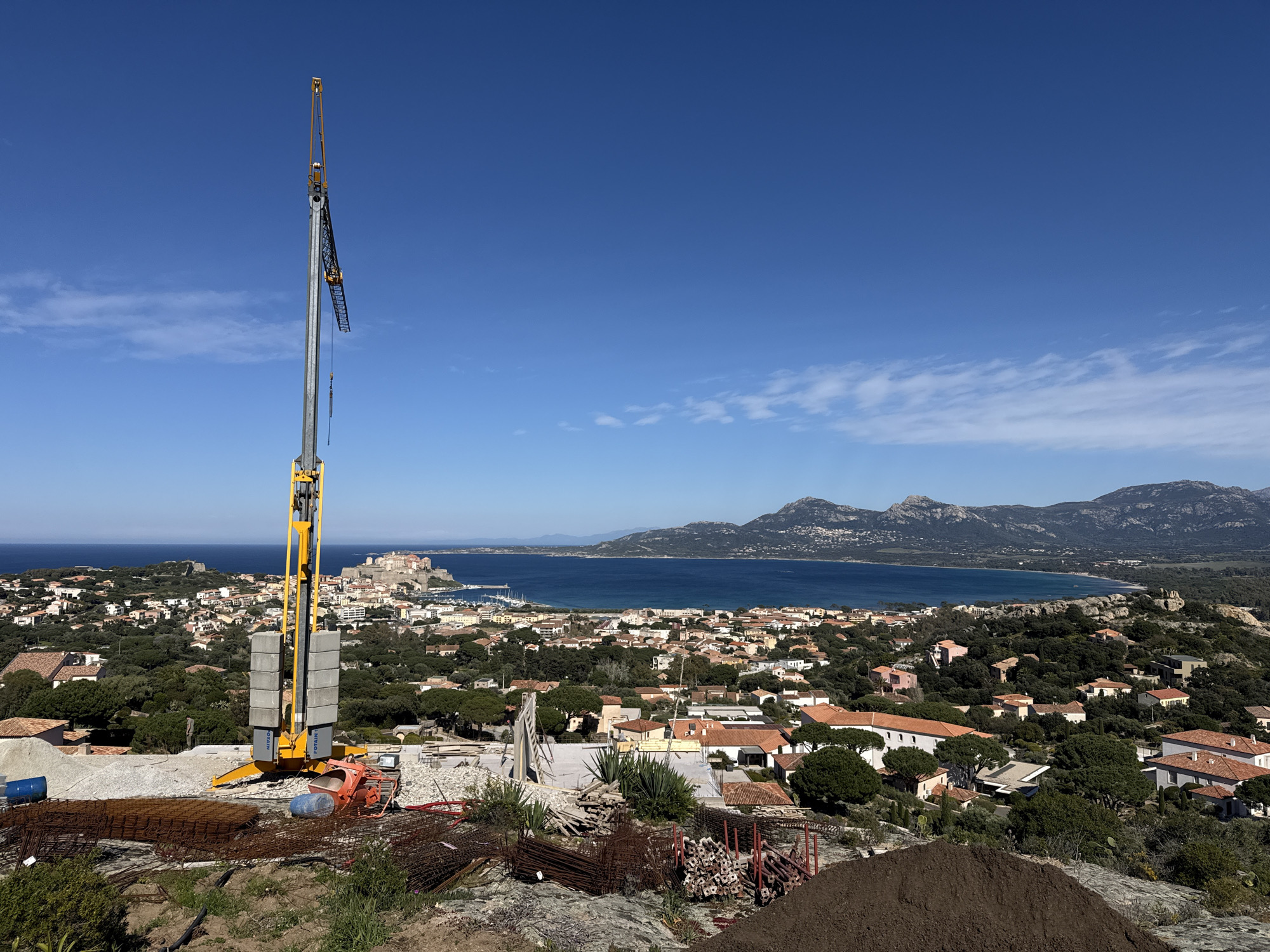 Construction site with crane observed overlooking Calvi, France