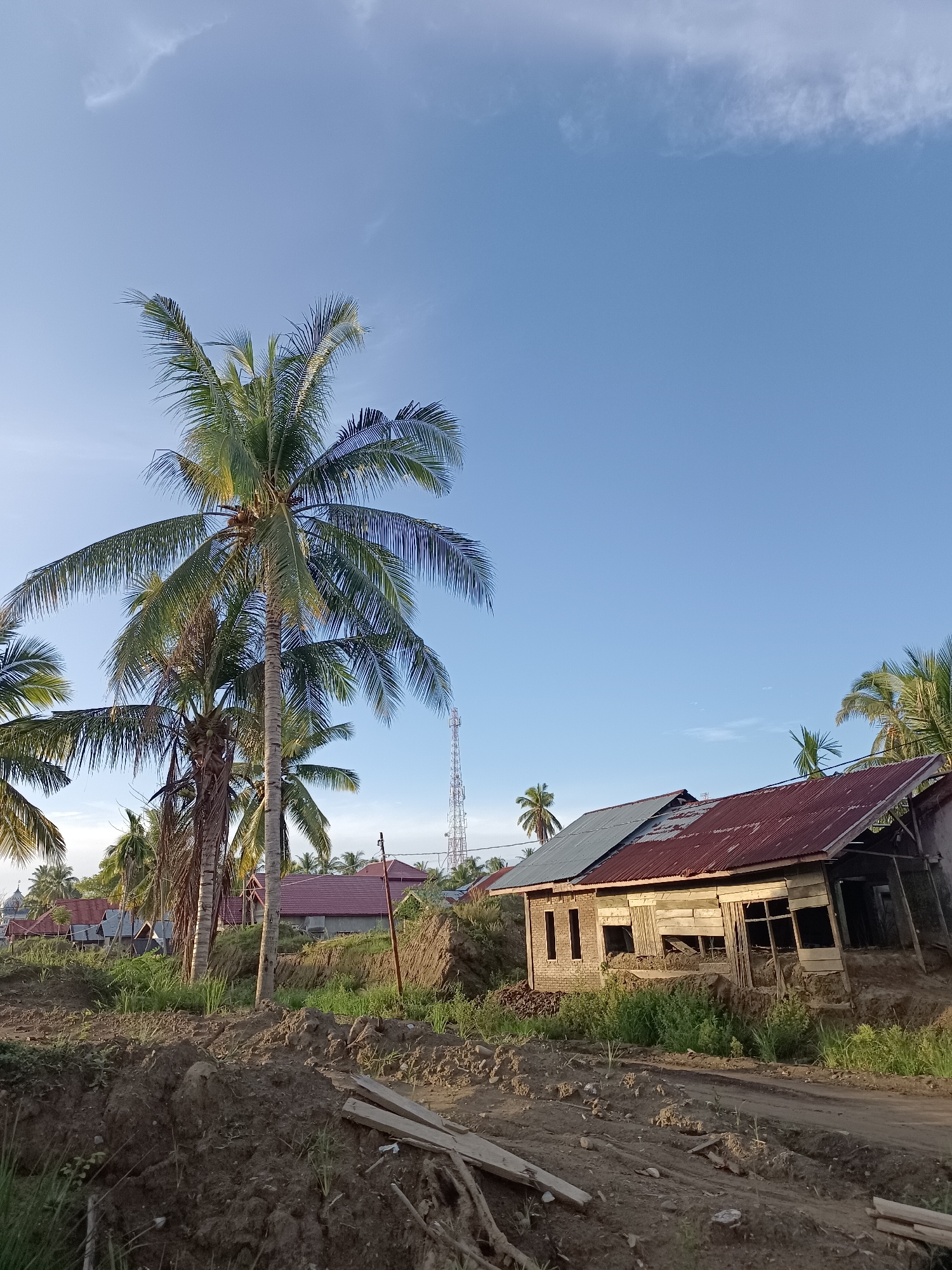 Rural village in Meunasah Raya shows construction, excavation, and local landmarks