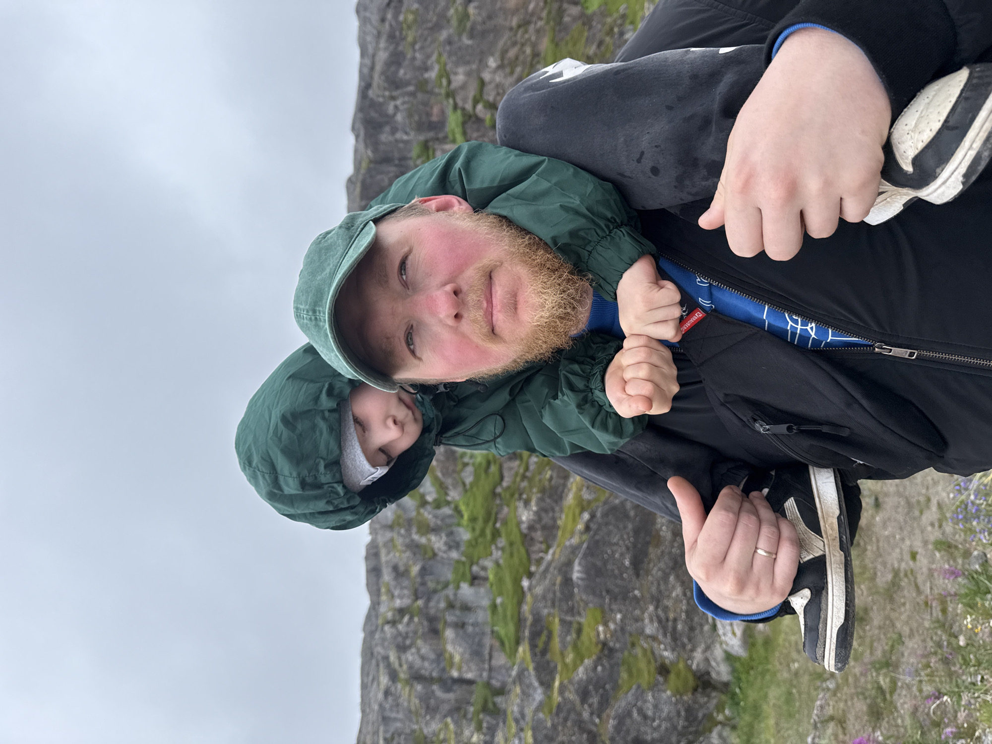 Exploring Teriberka's rocky Arctic coastline on a grey day