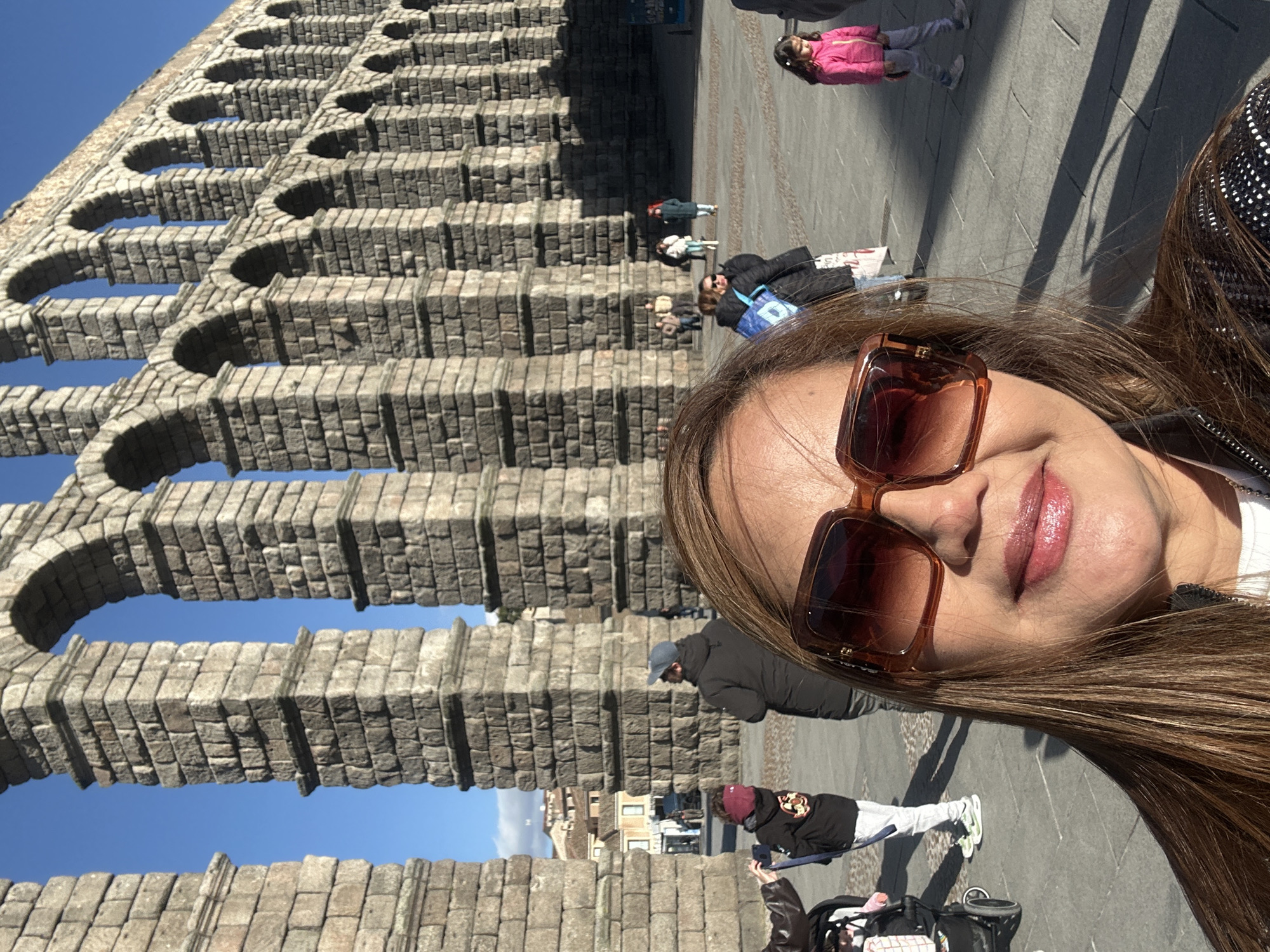 Tourist captures selfies at Roman Aqueduct of Segovia