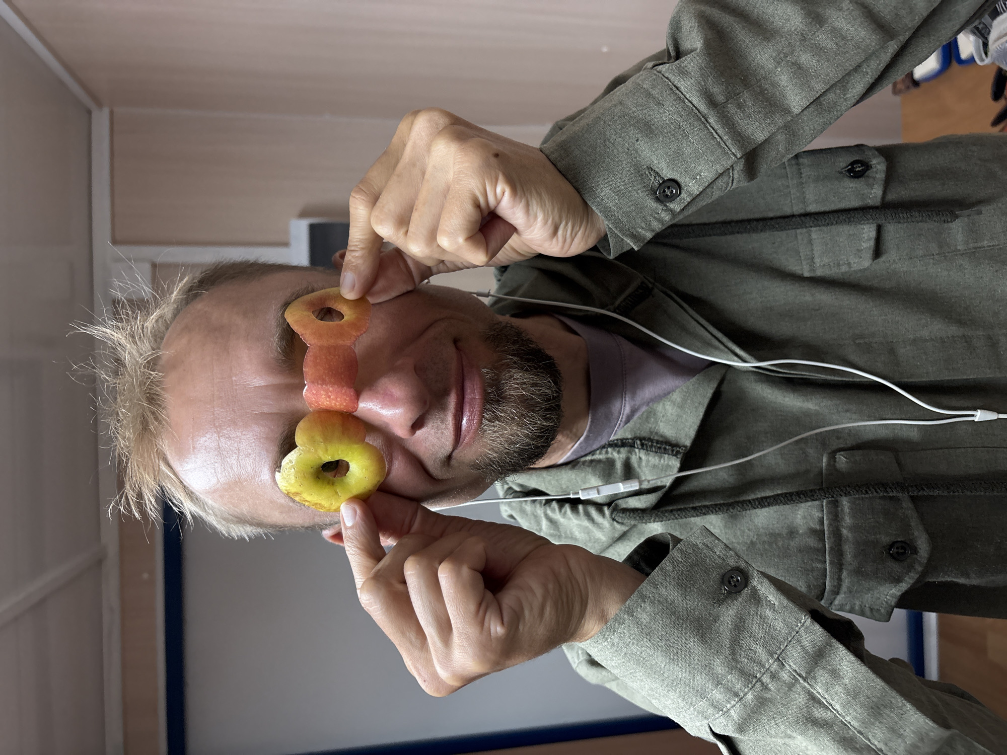 Couple plays with apple rings as glasses in Ukraine