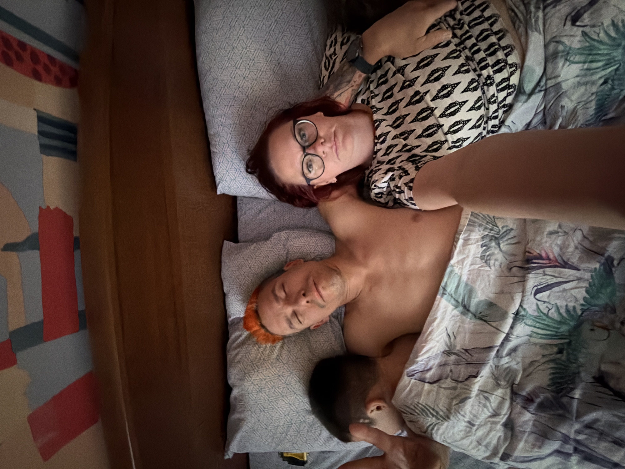 Family shares quiet bedroom moment in Chaikovsky, Russia