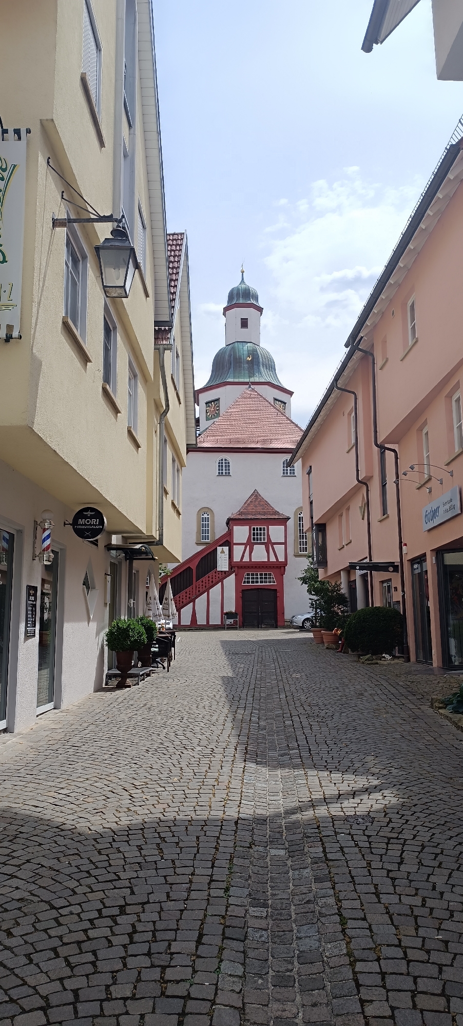 Cobblestone street leading to Winnenden's church tower