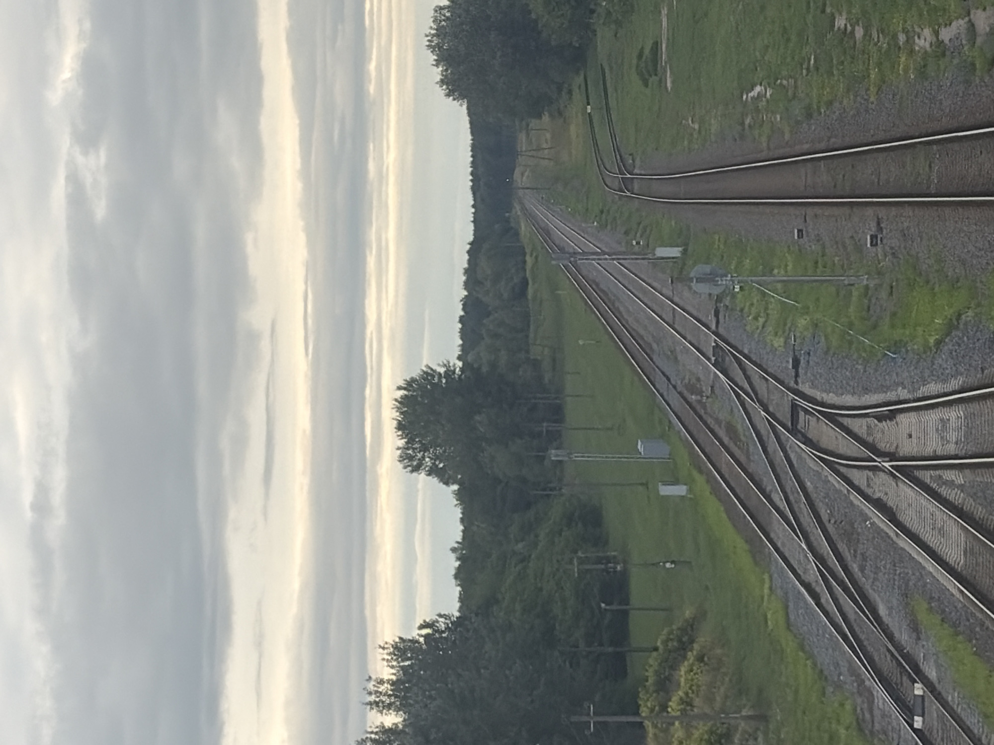 Railroad switchyard and water tower at sunset