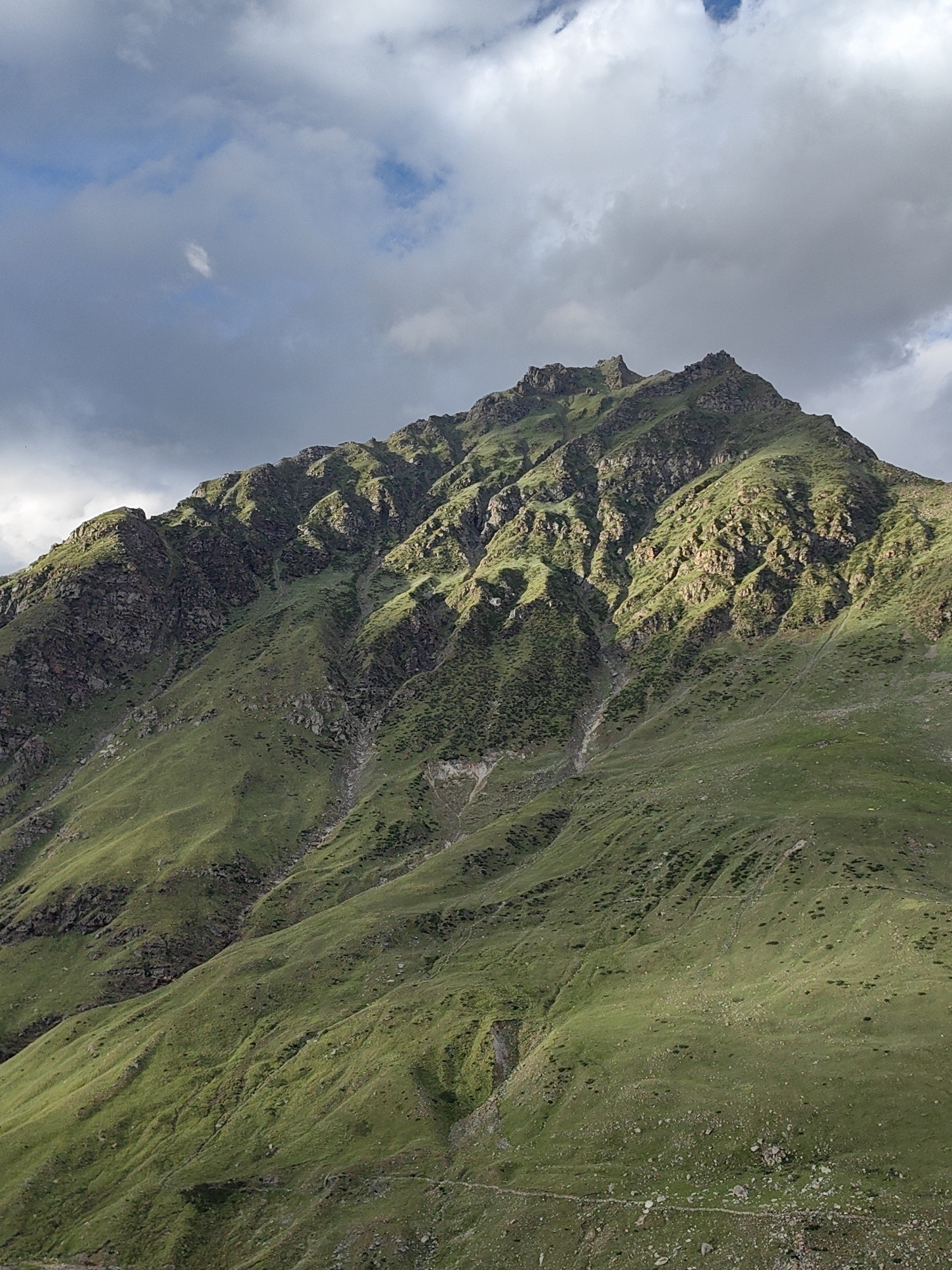 High-altitude motorcycle ride through Gramphu's rugged mountain valley