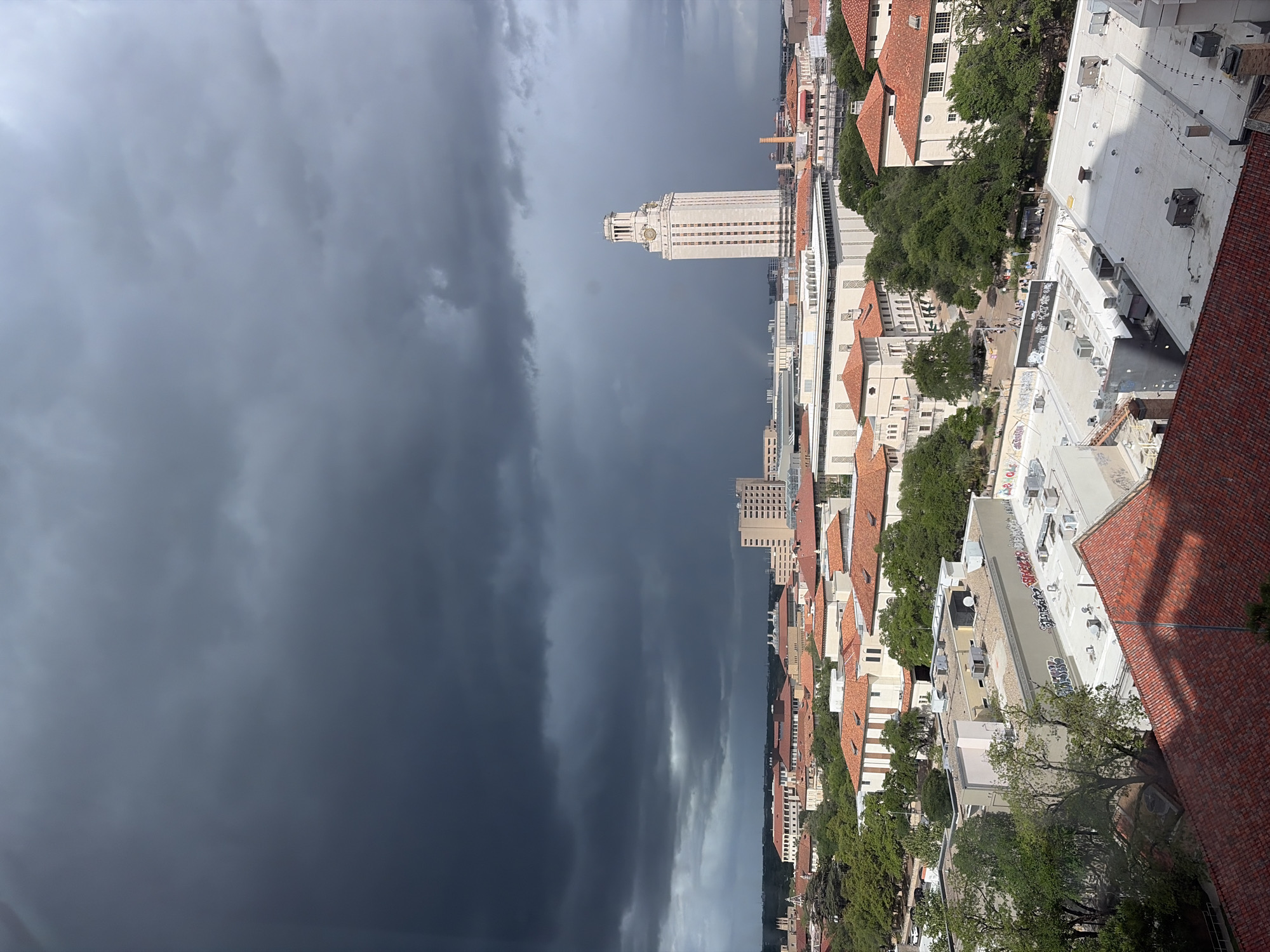 Storm front creates dramatic skies over Austin campus, downtown