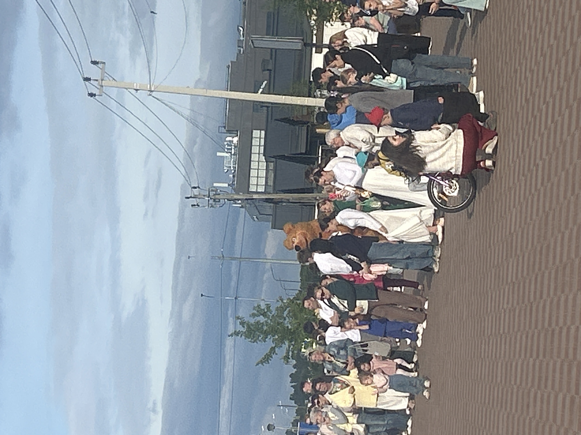 Costumed characters and performers at an outdoor plaza event