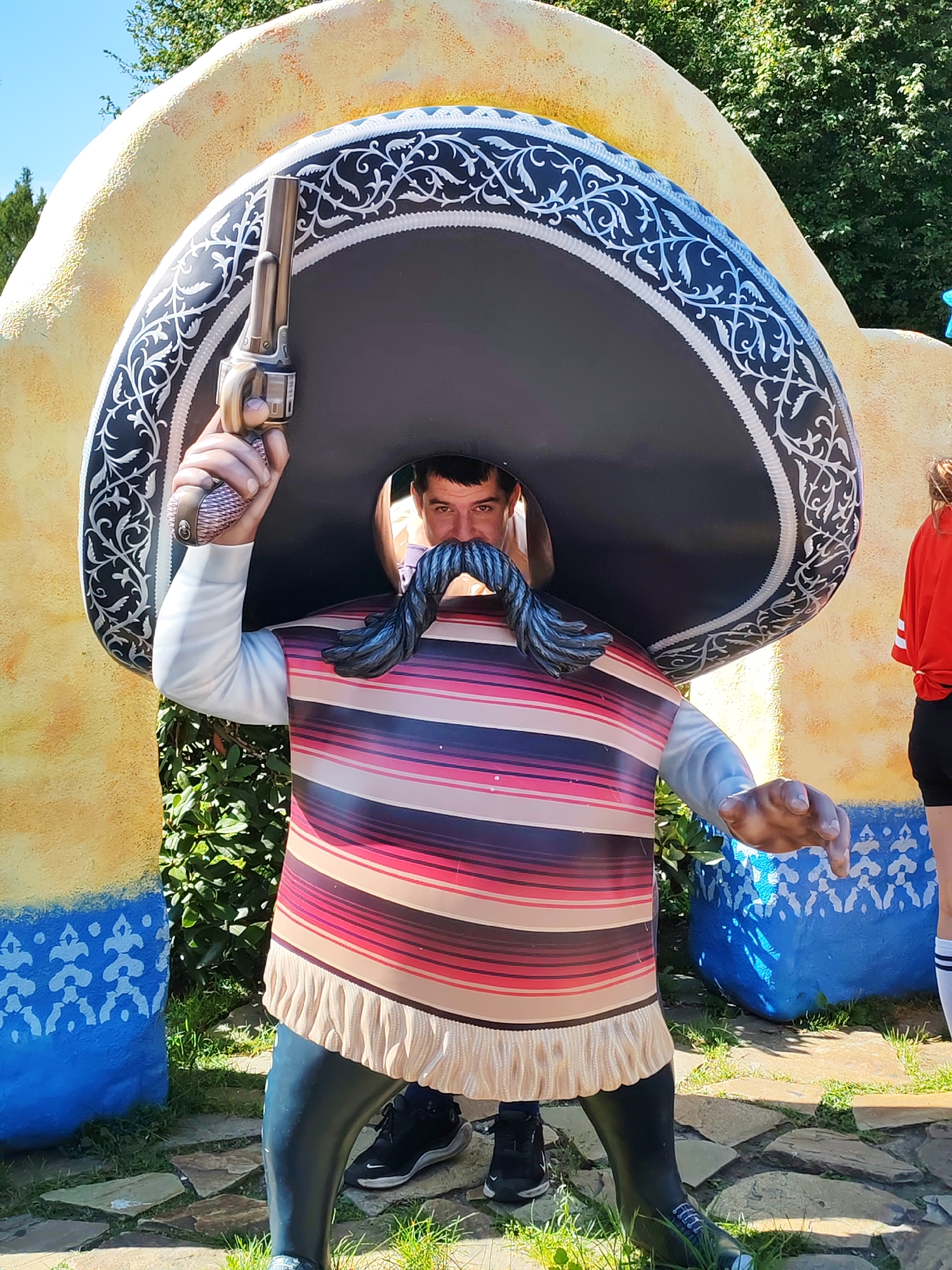 Wandering a quirky amusement park full of colorful statues and rides