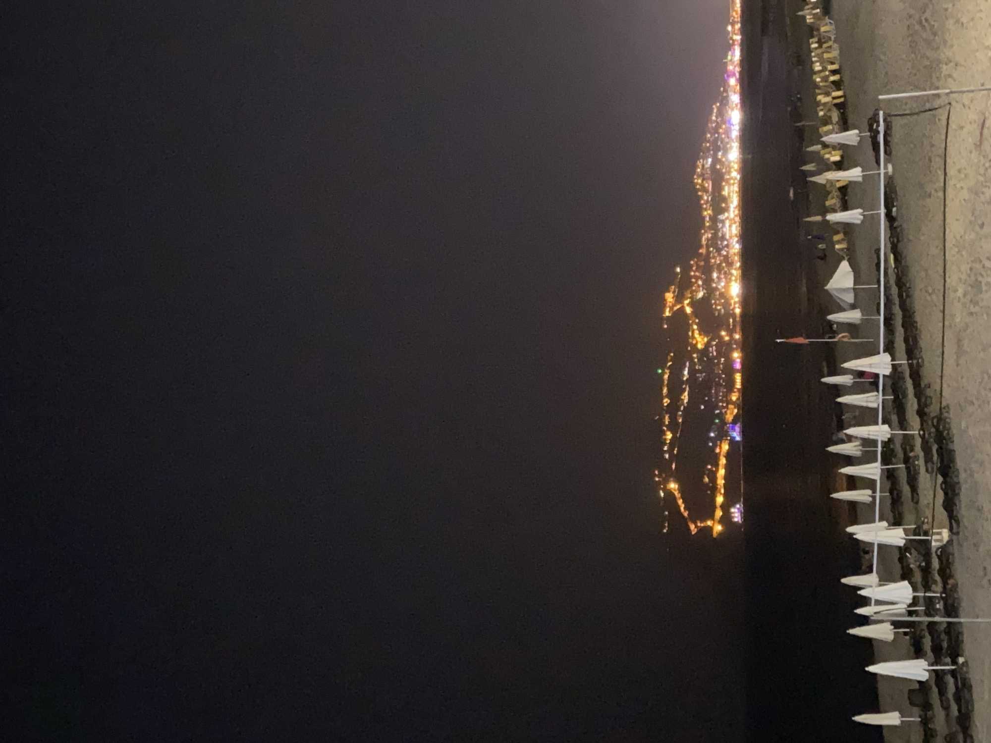 Alanya after dark: beach, moonlit sea, and city streets
