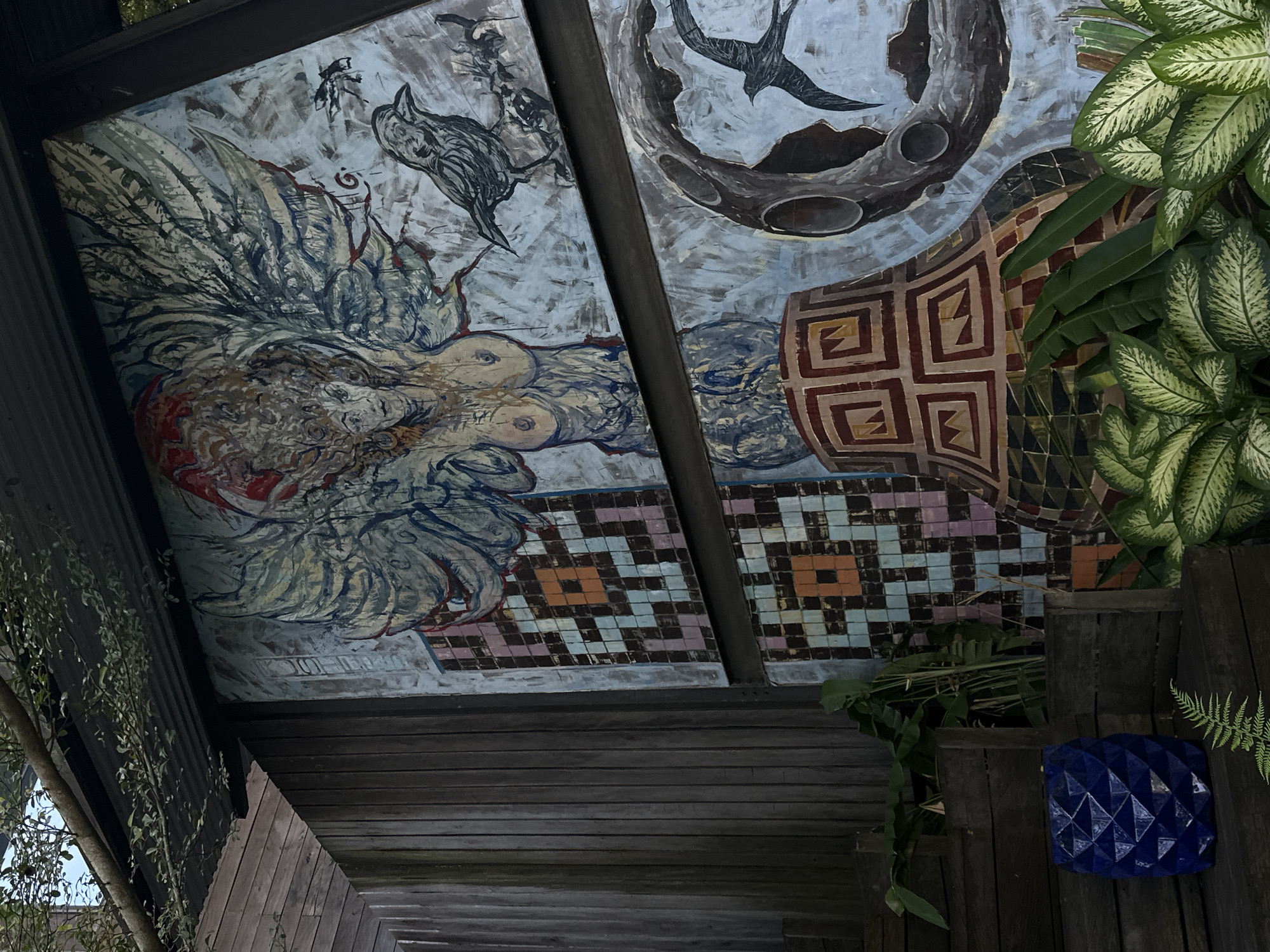 Diner documents ornate restaurant murals and courtyards in Singakerta