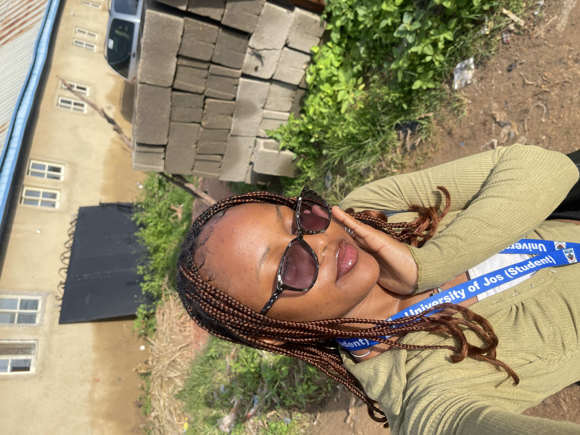 Selfie session in Rafin Par wearing a University of Jos lanyard