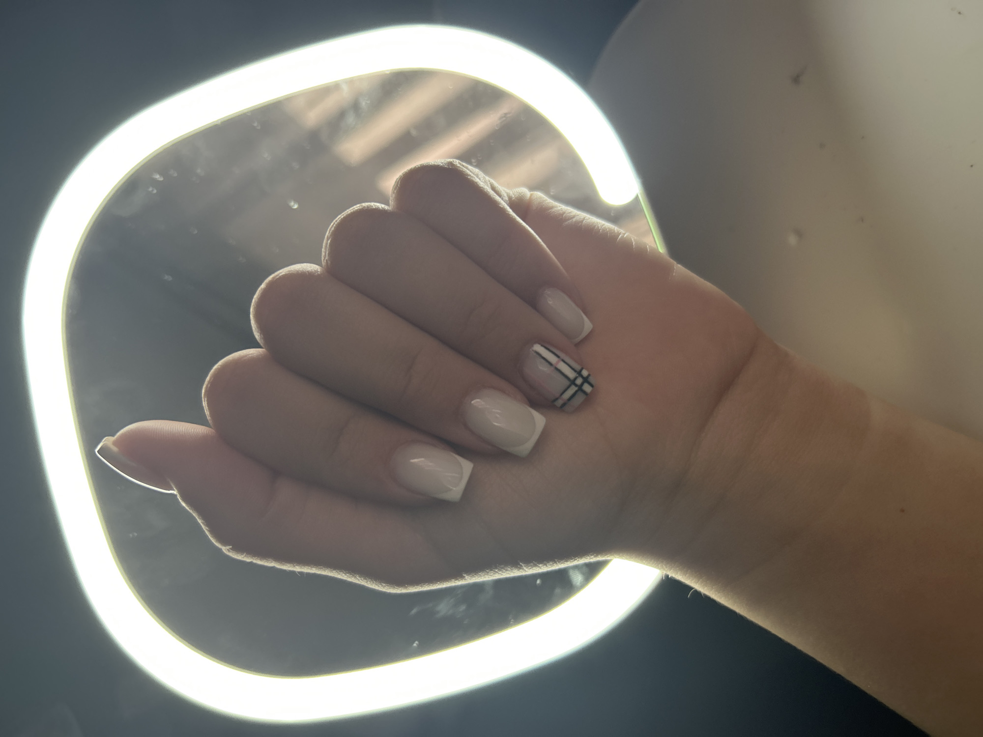 Everyday moments captured in Raduga: manicured nails, window view