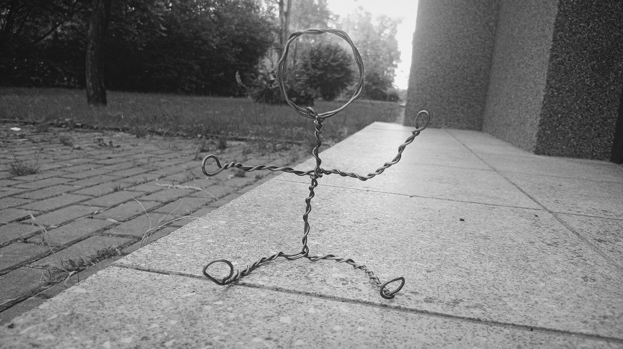 Wire figure sculpture photographed outdoors in Karviná, Czechia