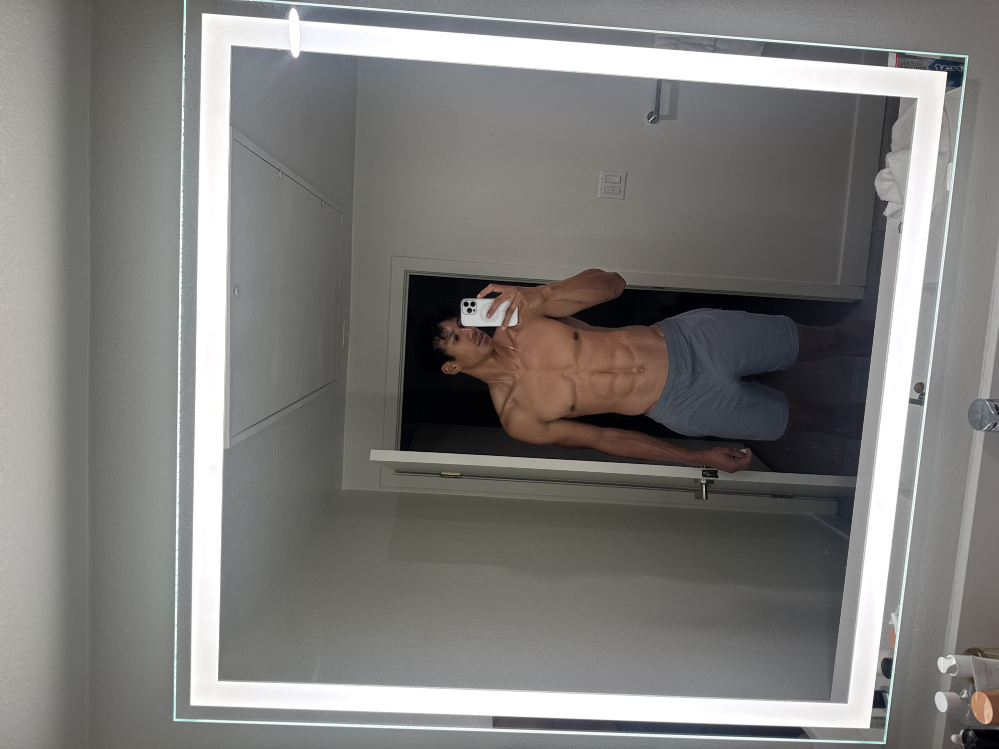 Man documents morning skincare routine in Los Angeles bathroom