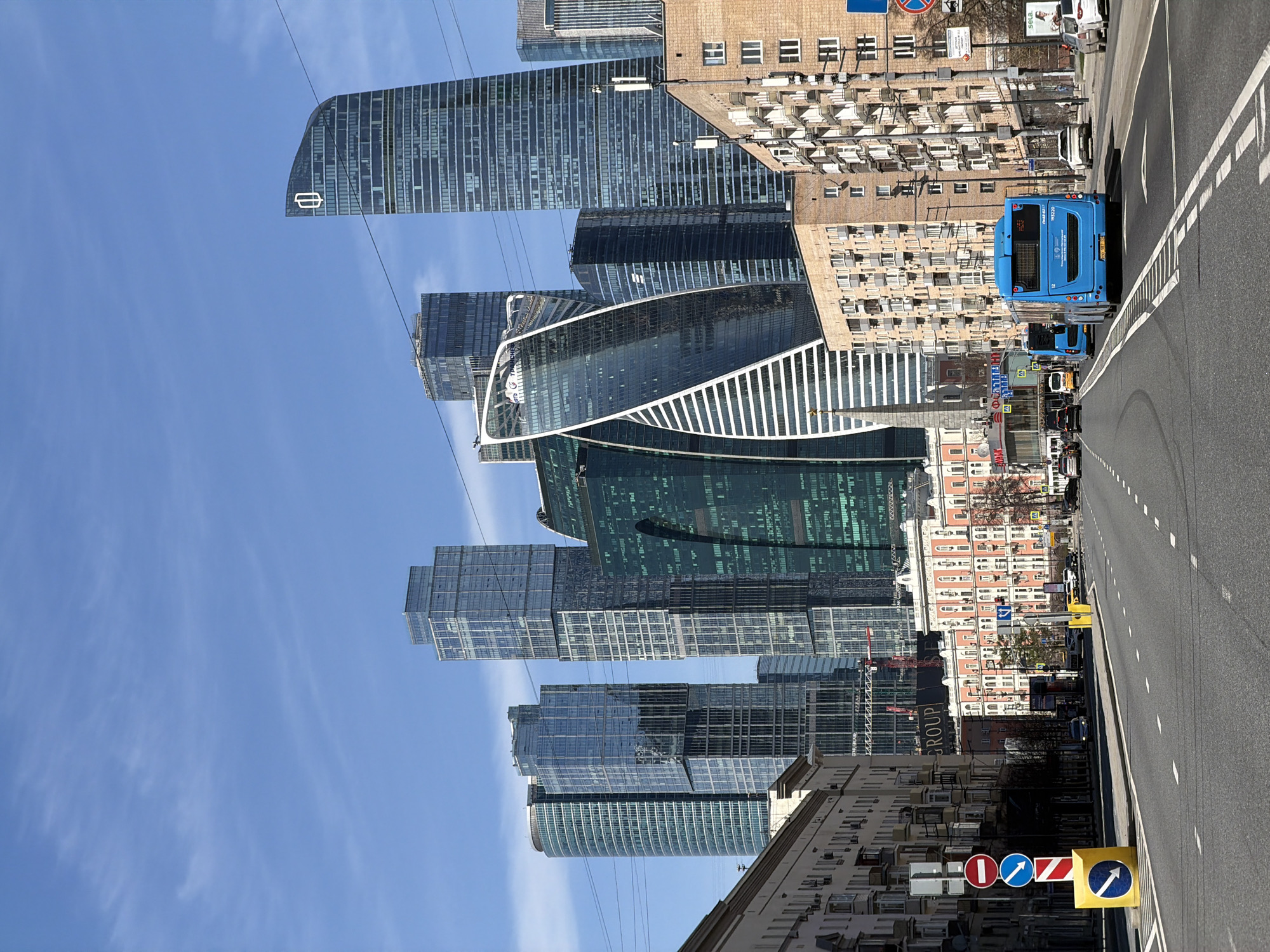 Morning traffic flows through Moscow intersection under clear skies
