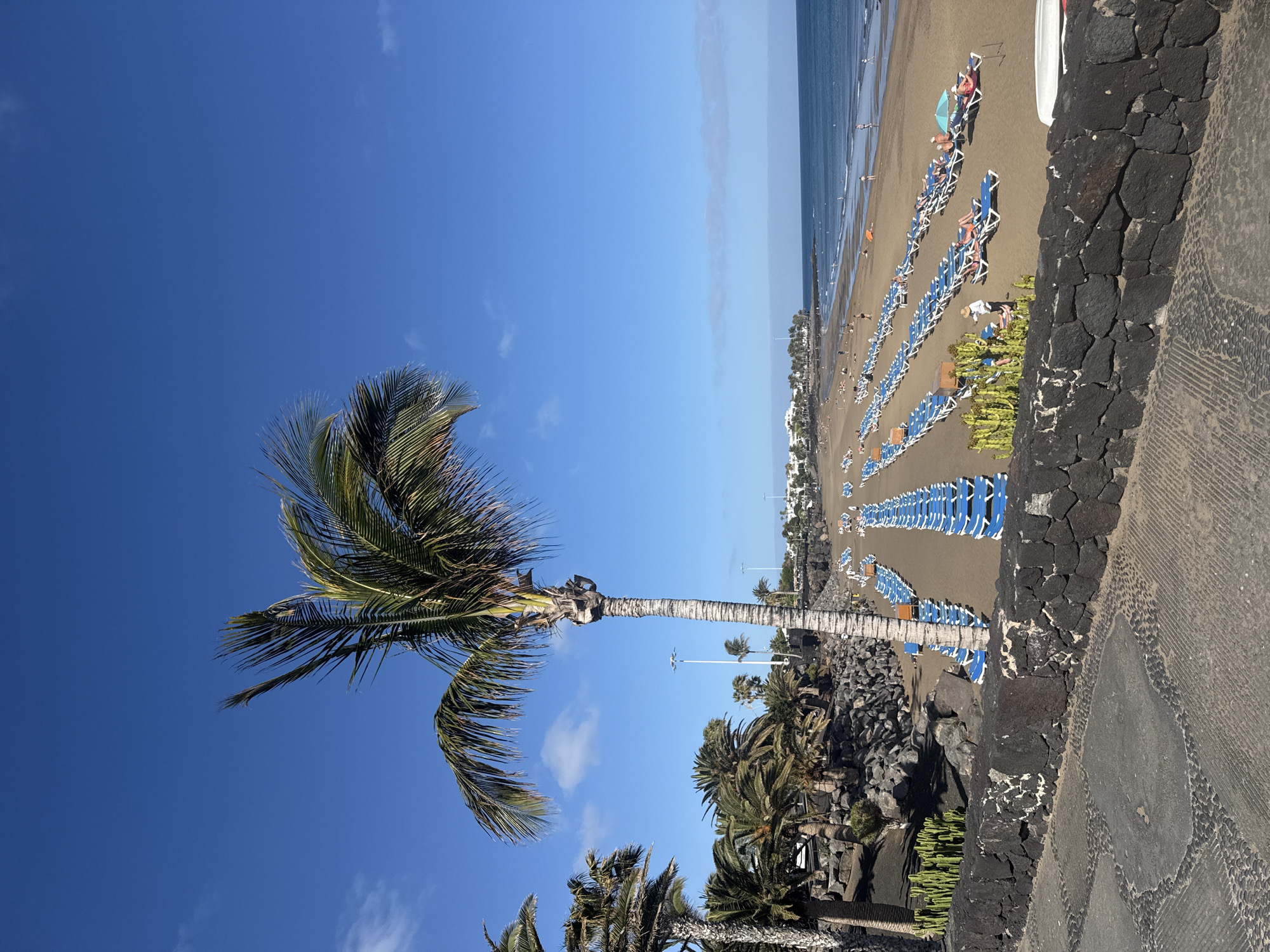 Tourist captures sunny Puerto Del Carmen beach and street scenes