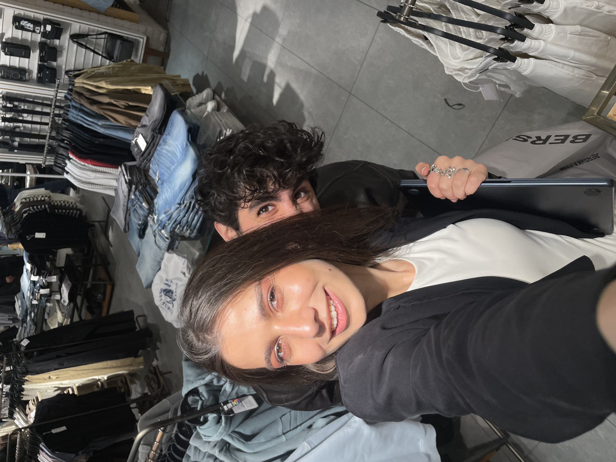 Couple takes mirror selfies while shopping in Yerevan store