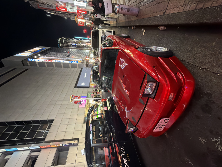 Modified red Nissan 180SX spotted in nighttime Shibuya
