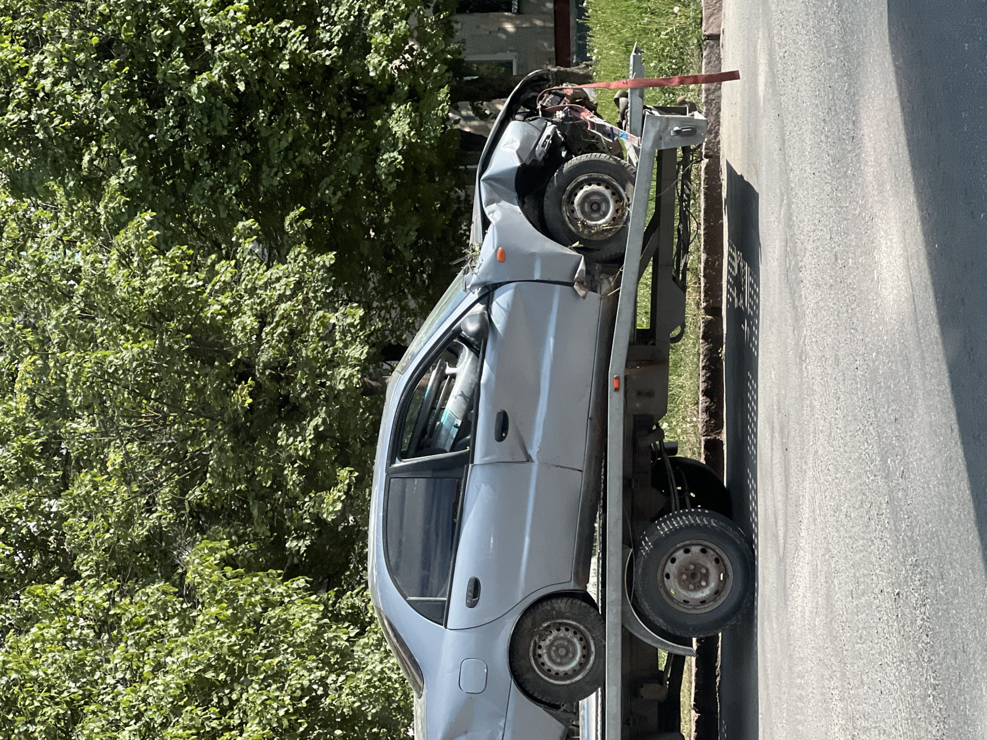 Vehicle accident aftermath and portrait photography documented in Ternopil