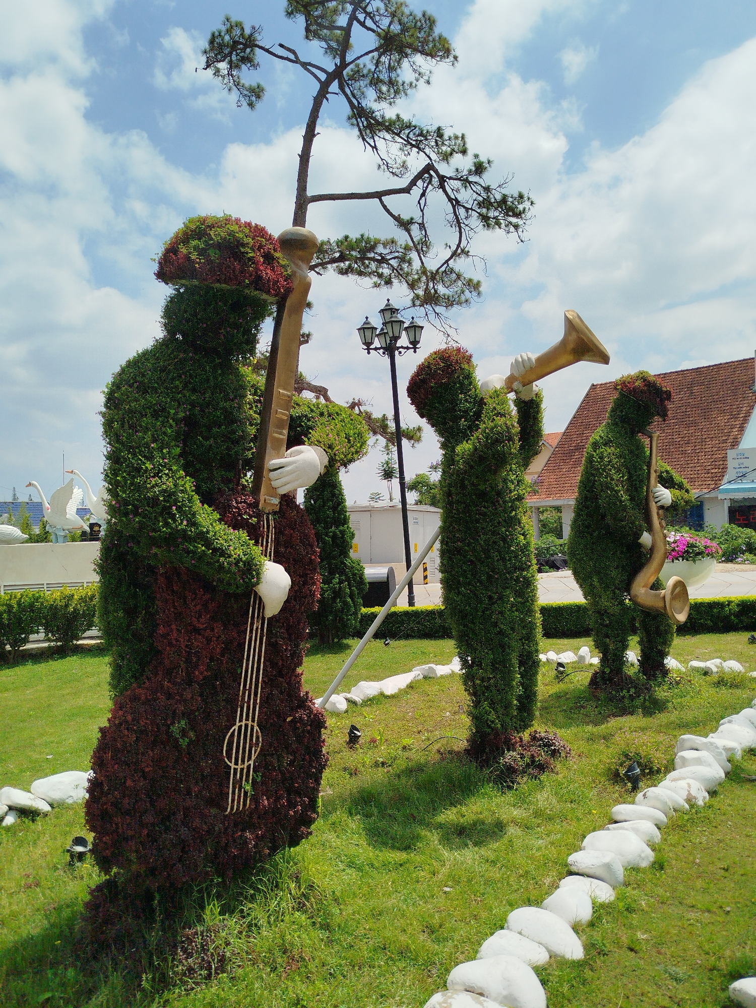Tourist documents elaborate topiary garden displays in Da Lat