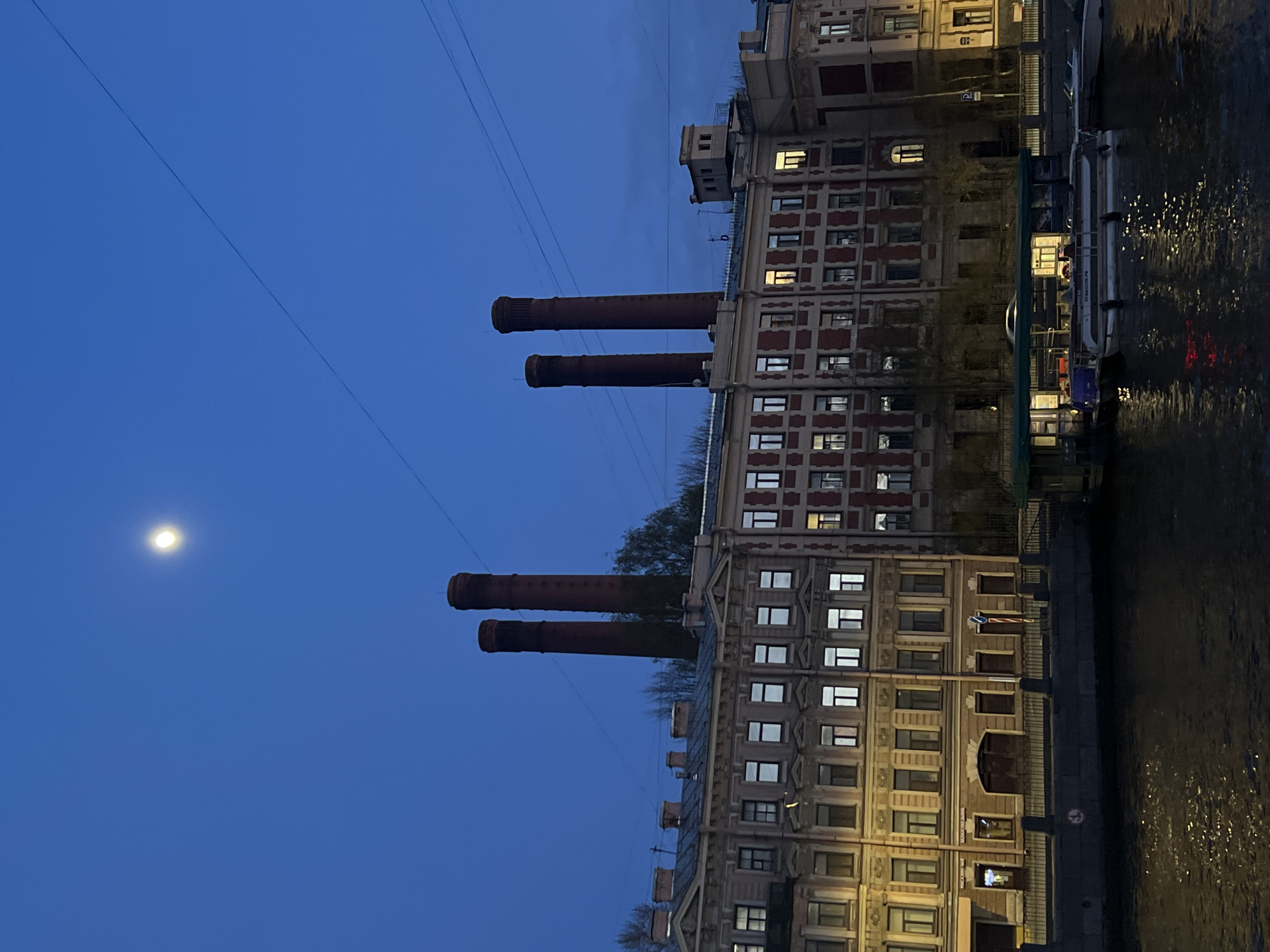 Evening moon rises over Saint Petersburg waterfront walkway