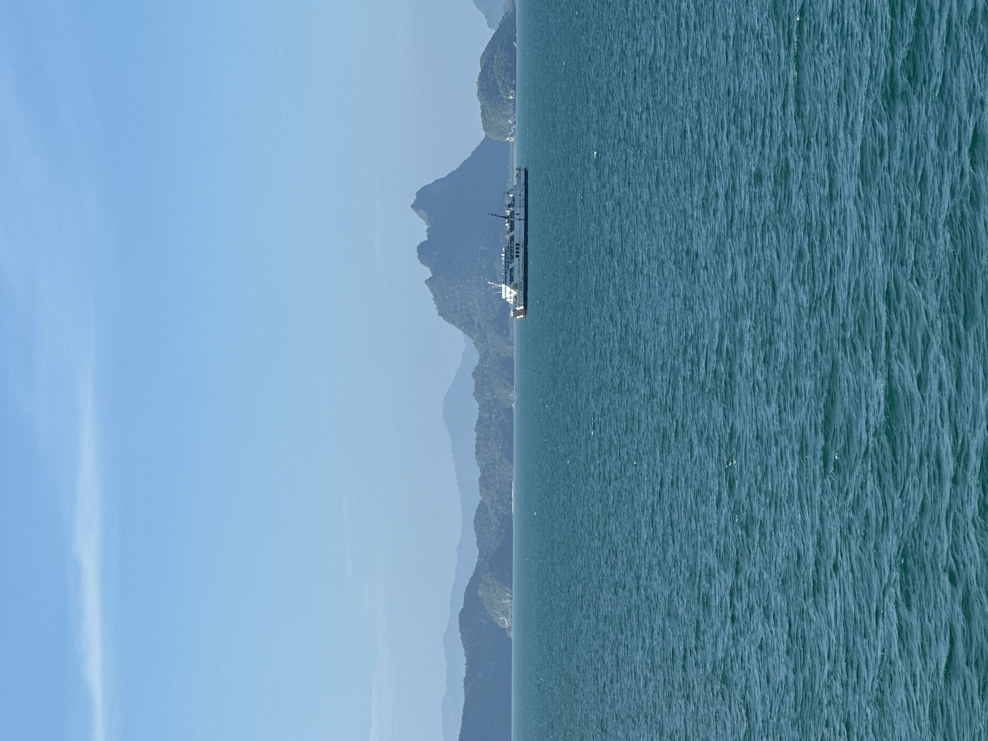 Ferry crossing calm turquoise waters off the Thai island coast