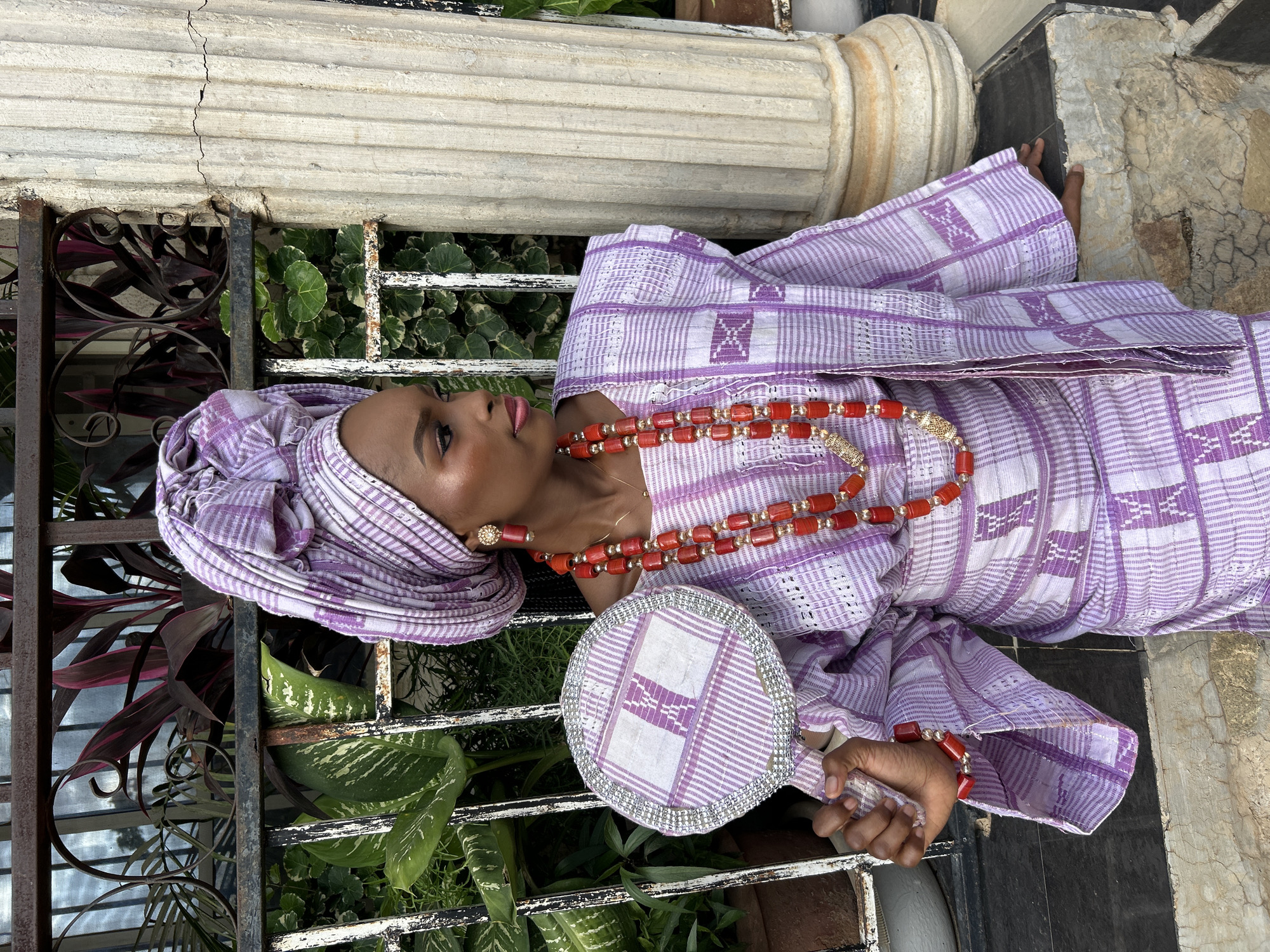 Portrait session in traditional African attire with decorative mirror
