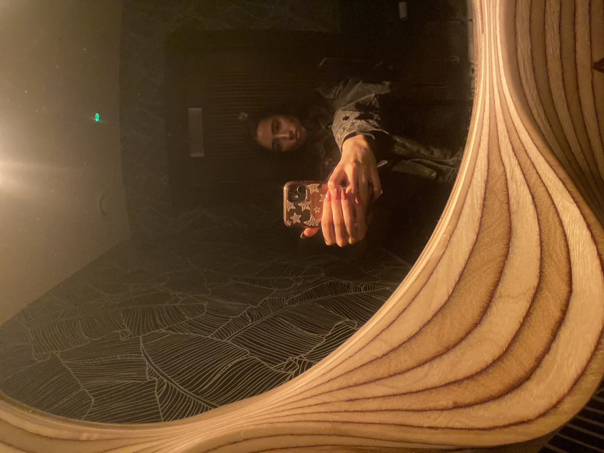 Woman takes mirror selfie in London bathroom