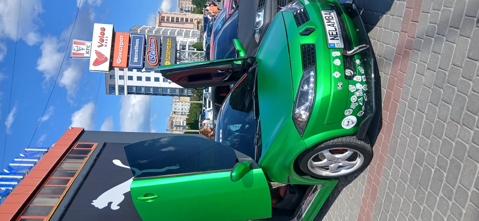 Colorful classic and sports cars at what looks like a car meet