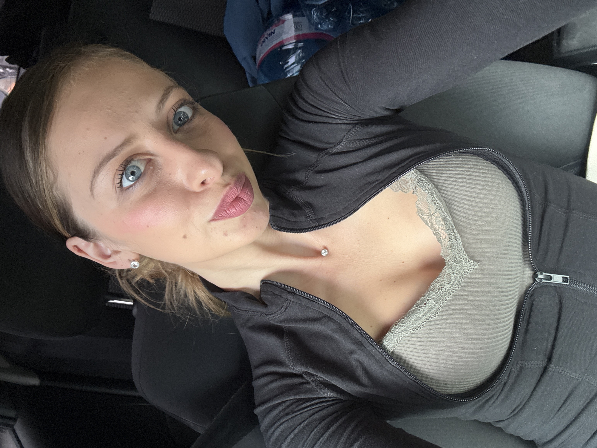 Woman takes selfie in car in Sofia, Bulgaria